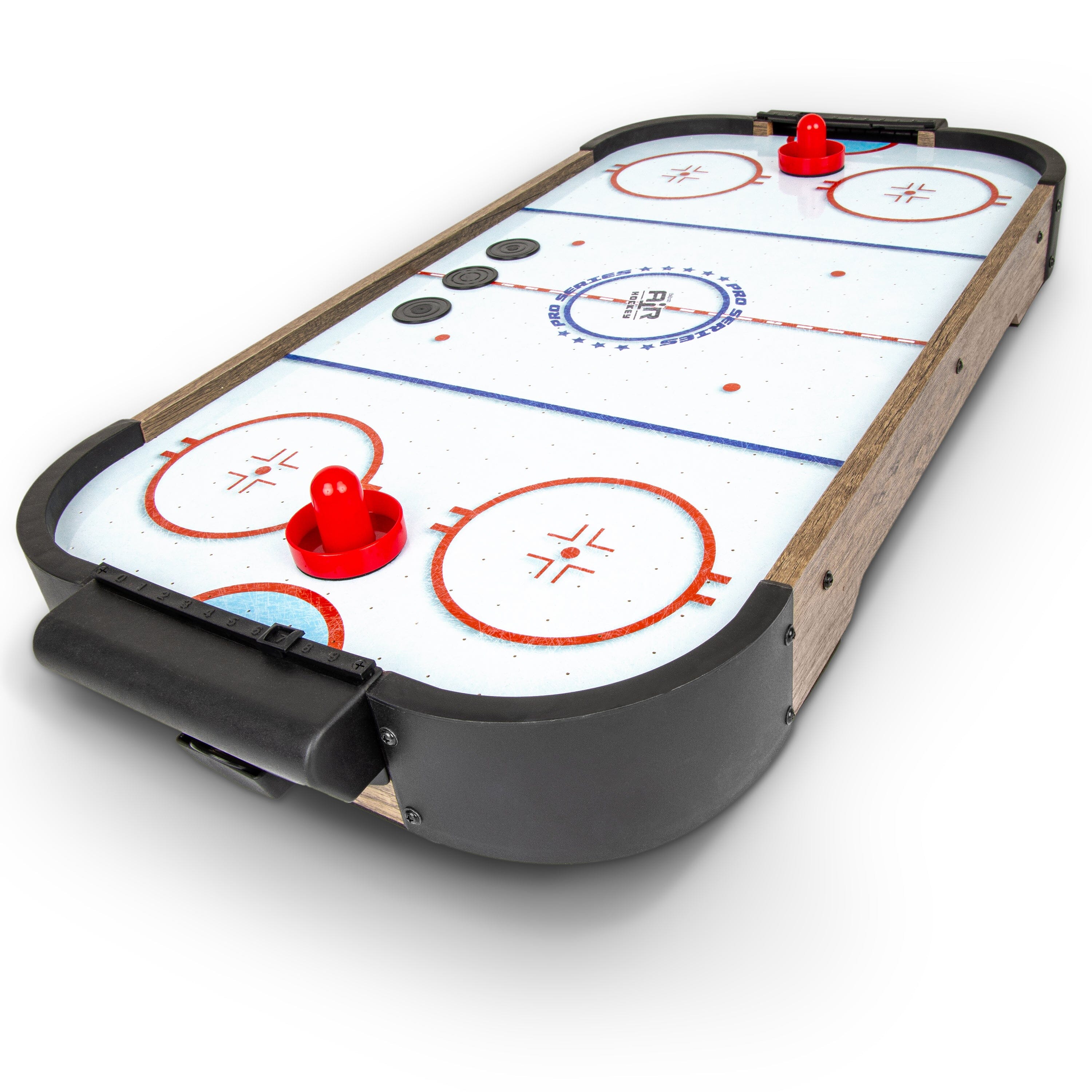 a hockey table with a puck and two pucks