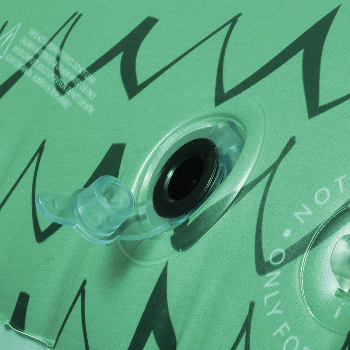 Close-up of the clear rapid valve on the green scaled vinyl of the GoFloats giant Fire Dragon pool float