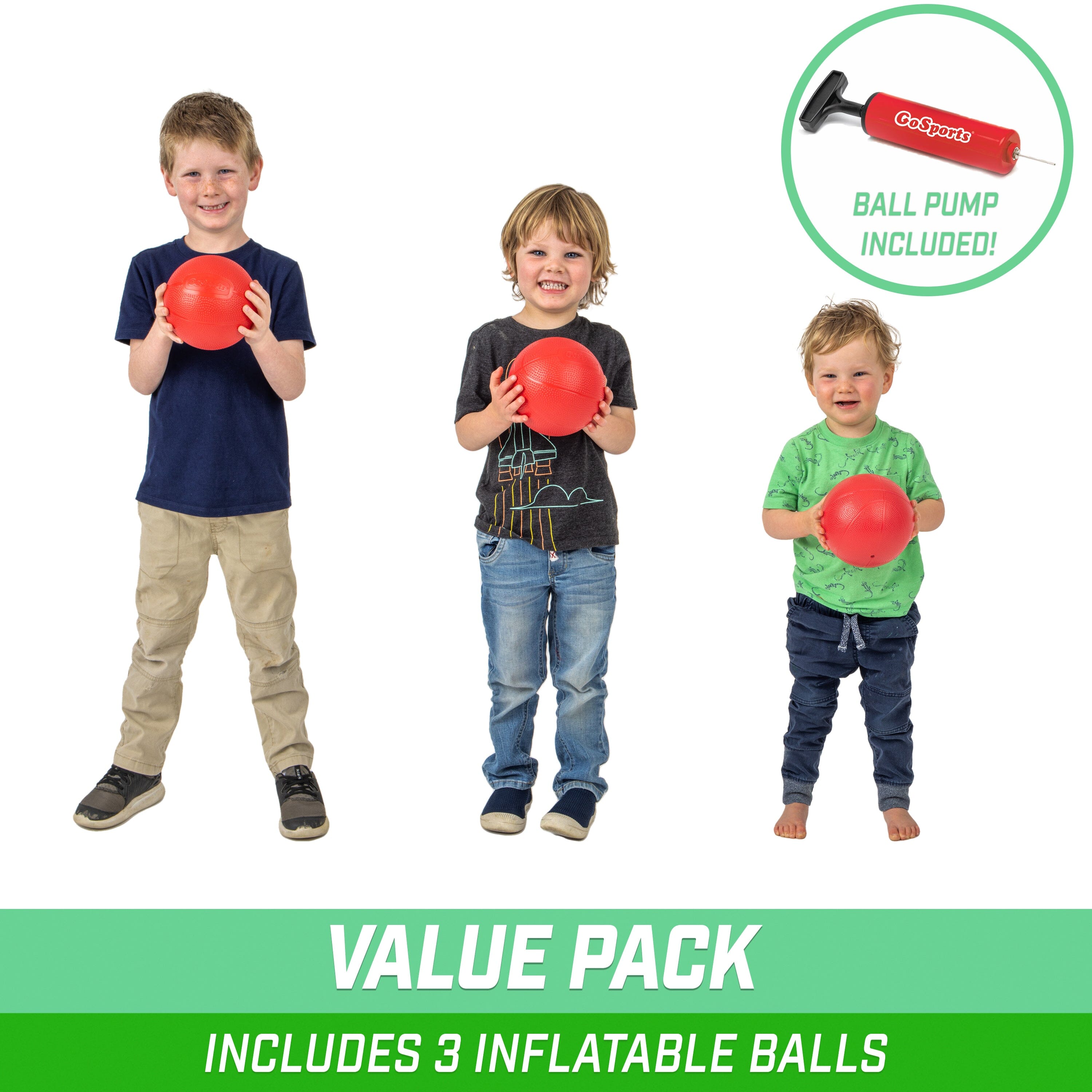 a group of kids holding up red balls