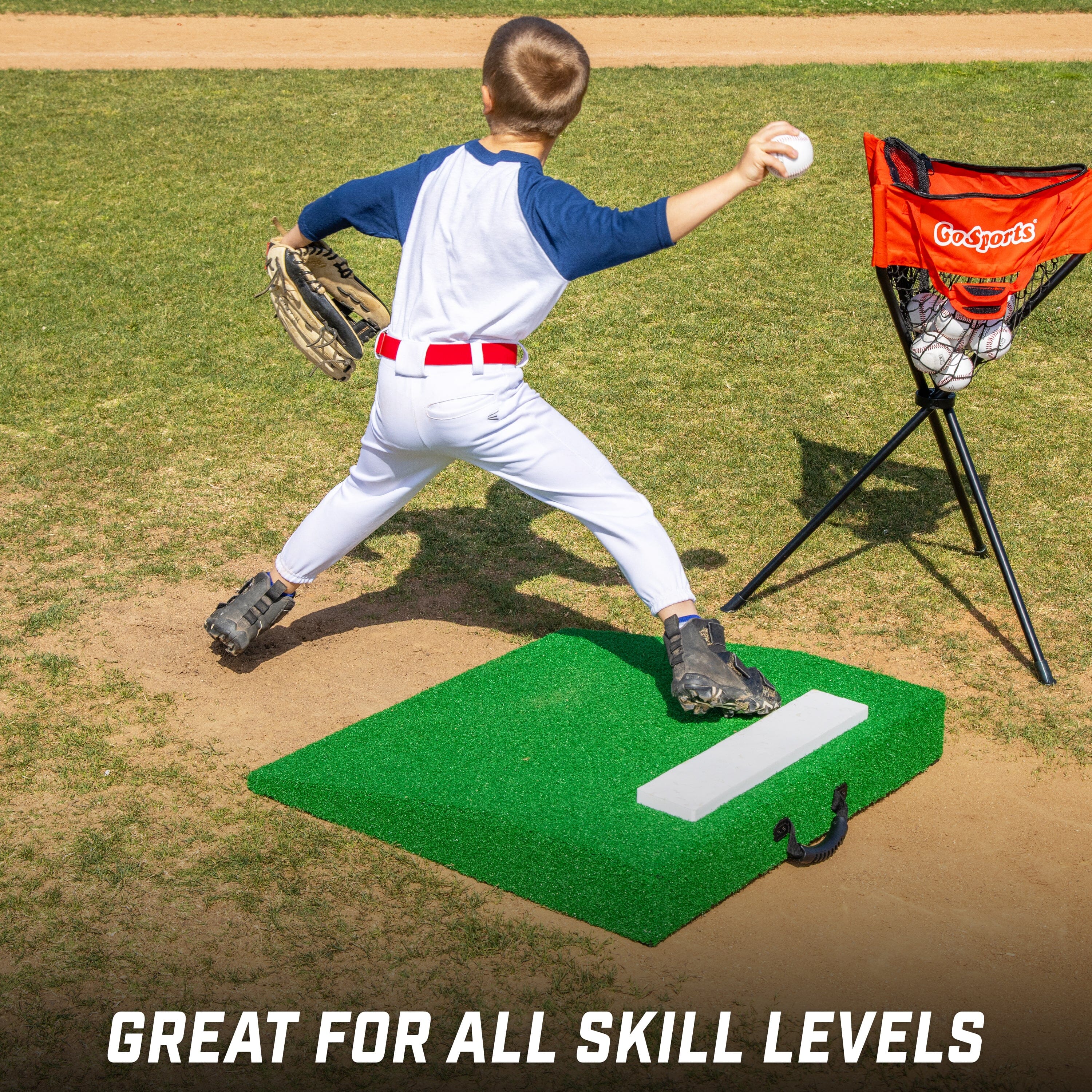 a young boy in a baseball uniform throwing a ball