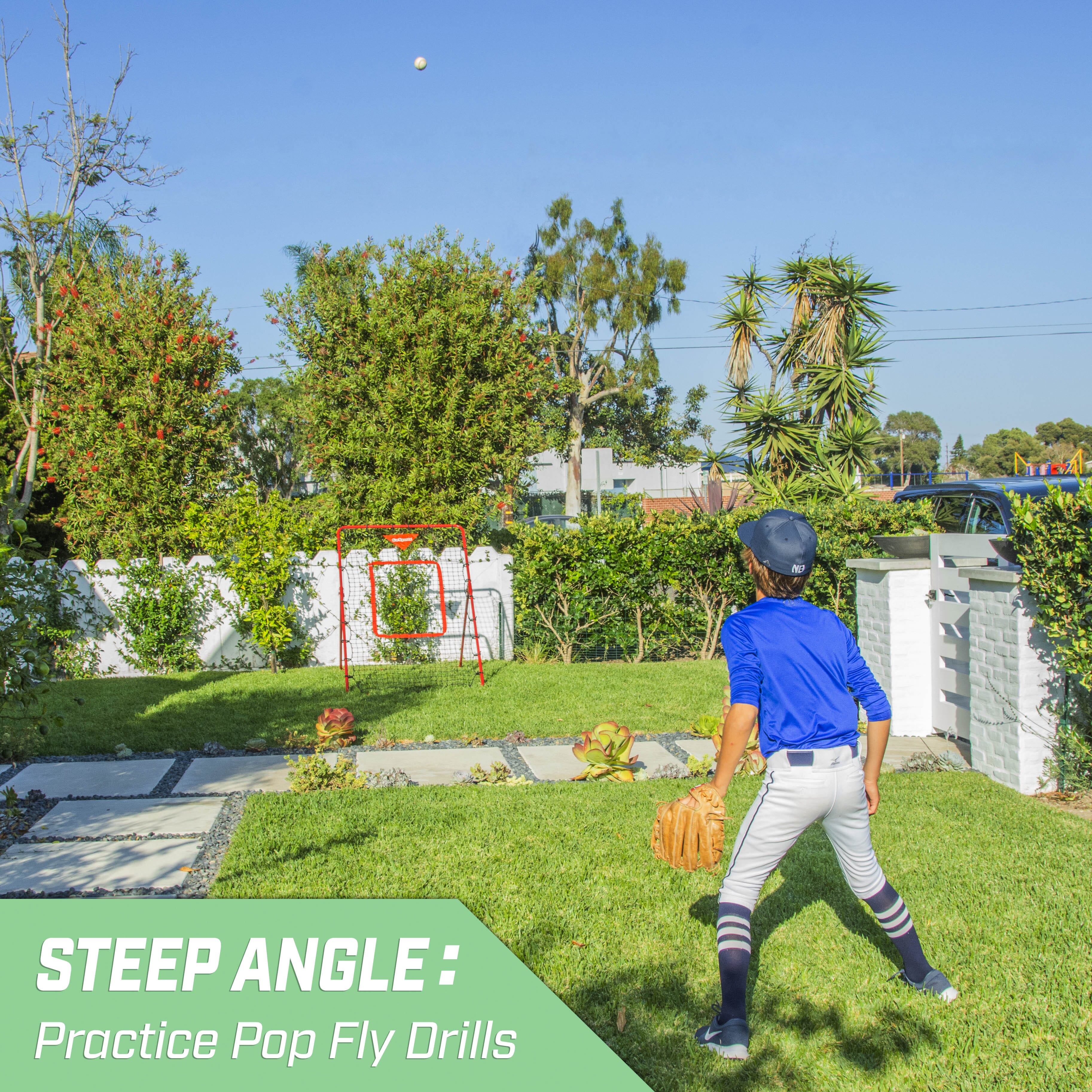 a young boy in a blue shirt and gray pants playing baseball