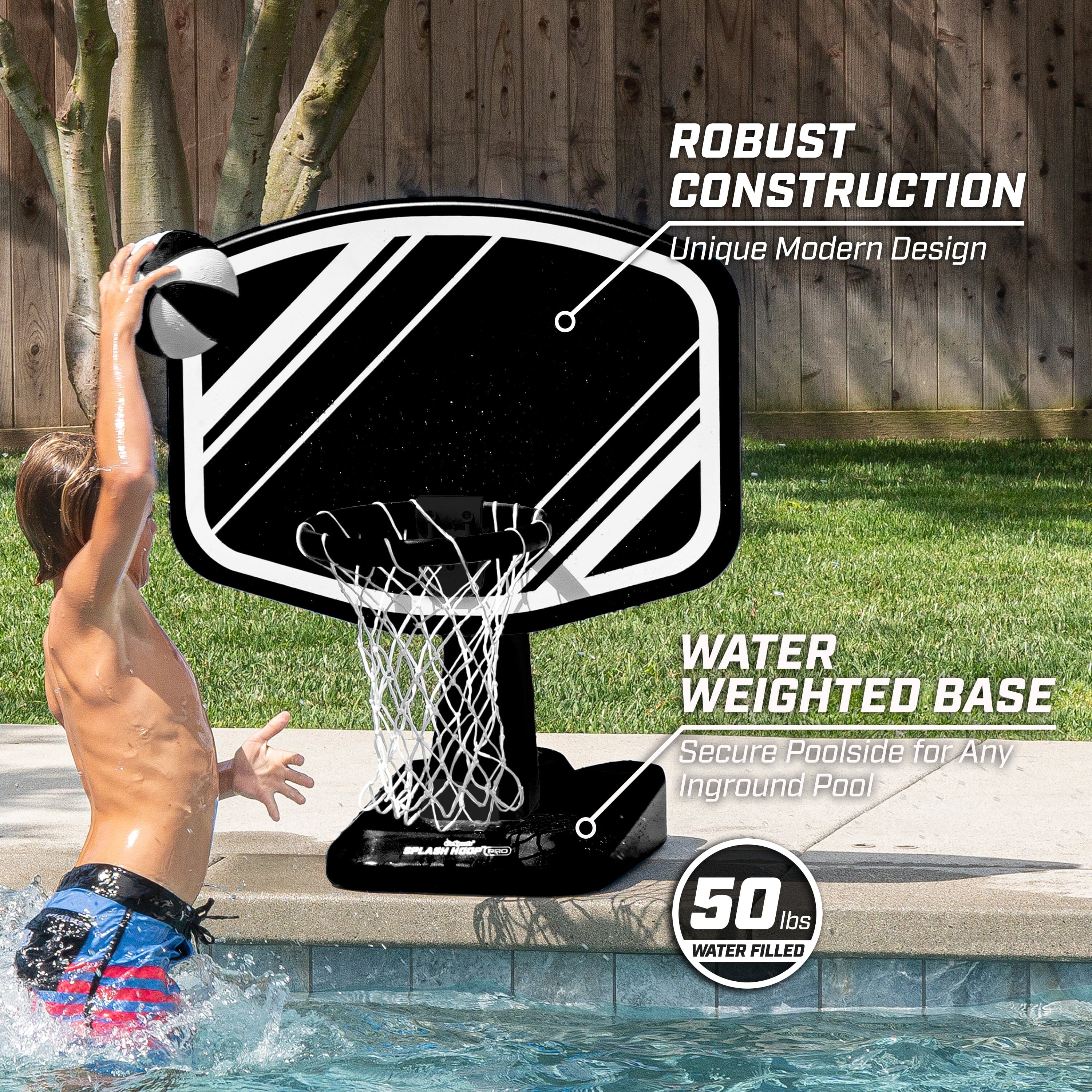 a boy is playing with a basketball hoop