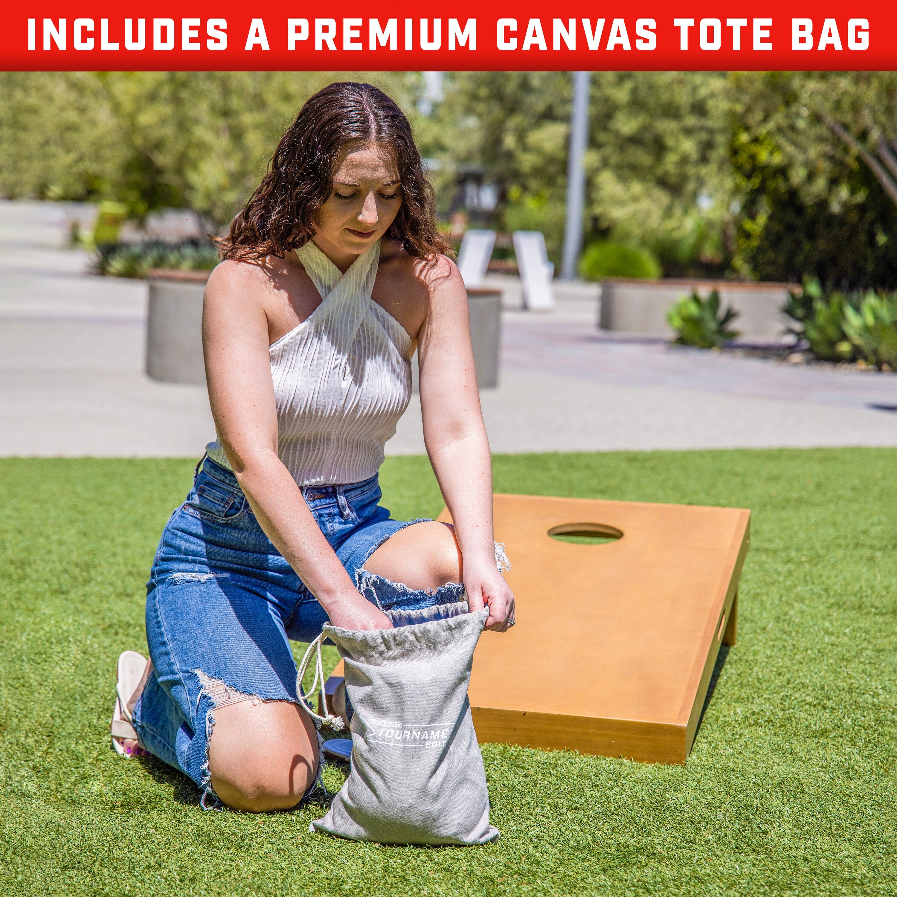 a woman sitting on the grass