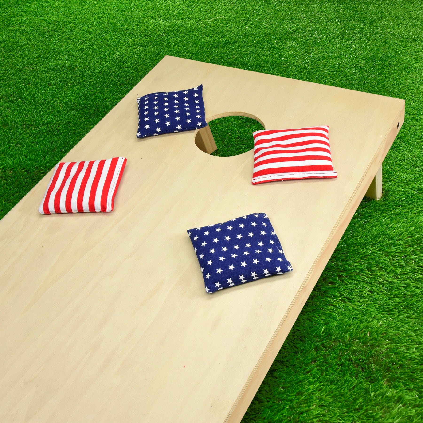a wooden corno game with american flags on it