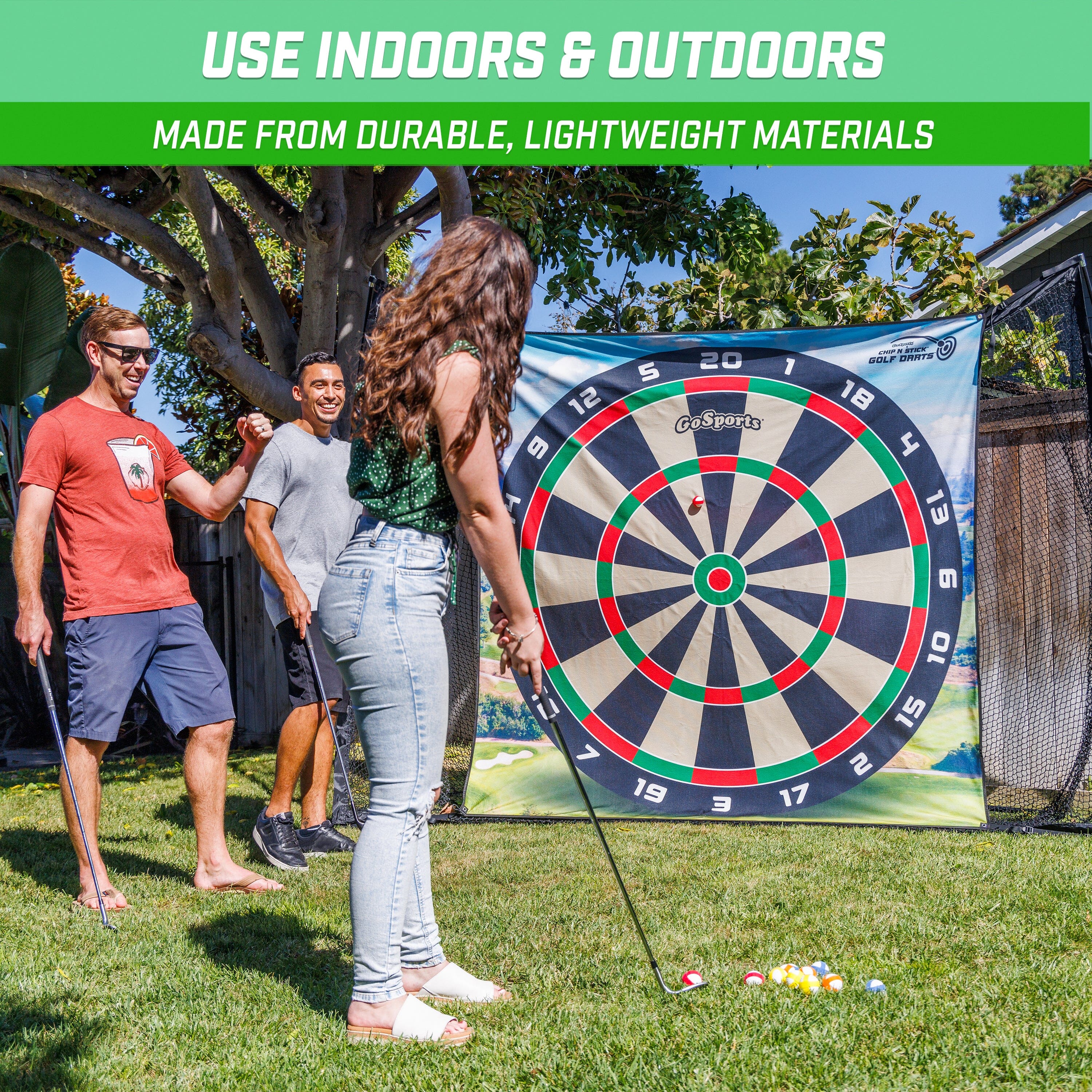 a woman and man playing a game of darts
