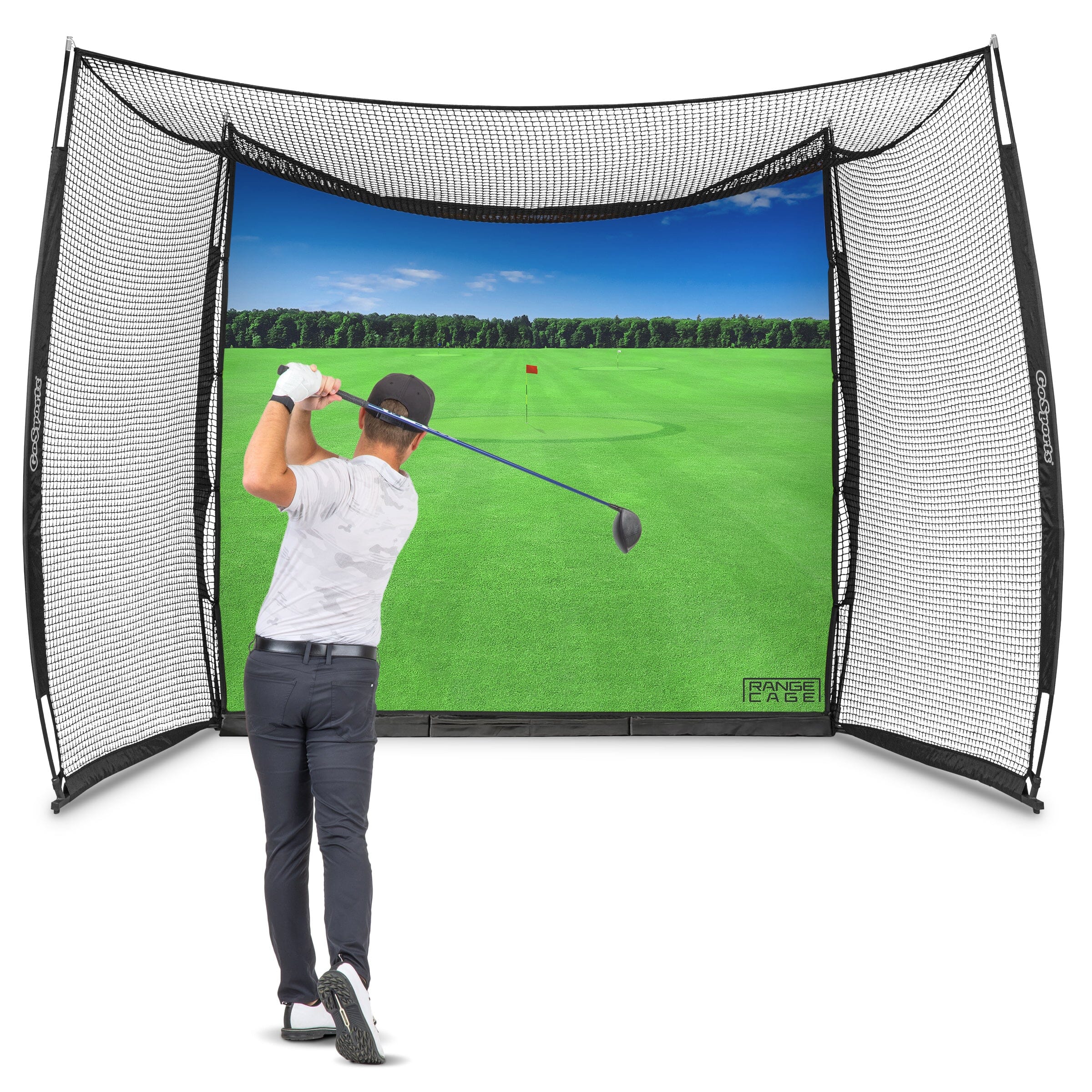 golf hitting net with a man swinging a golf ball