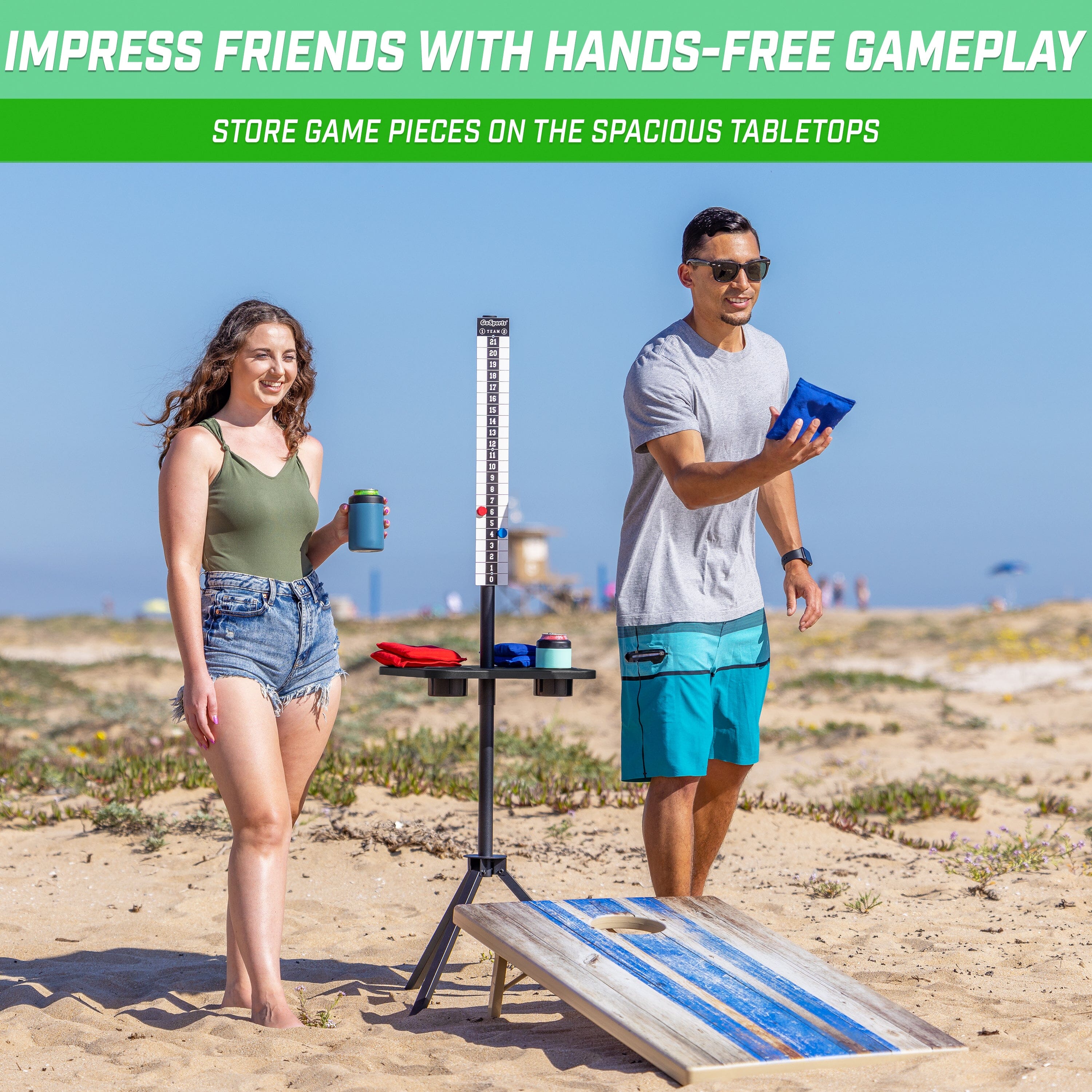 a man and woman standing on the beach with a surfboard