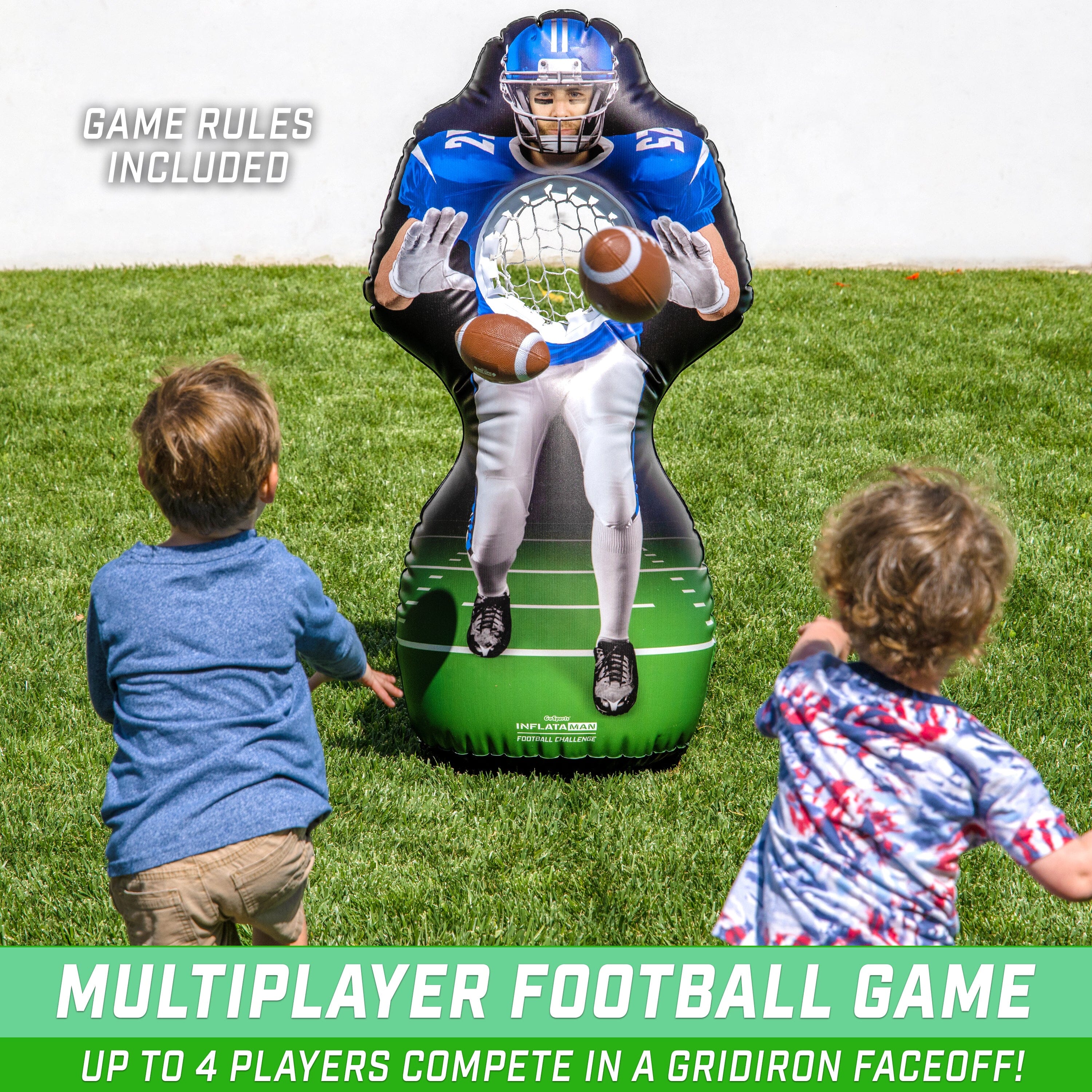 a young boy is playing with a football inflatable