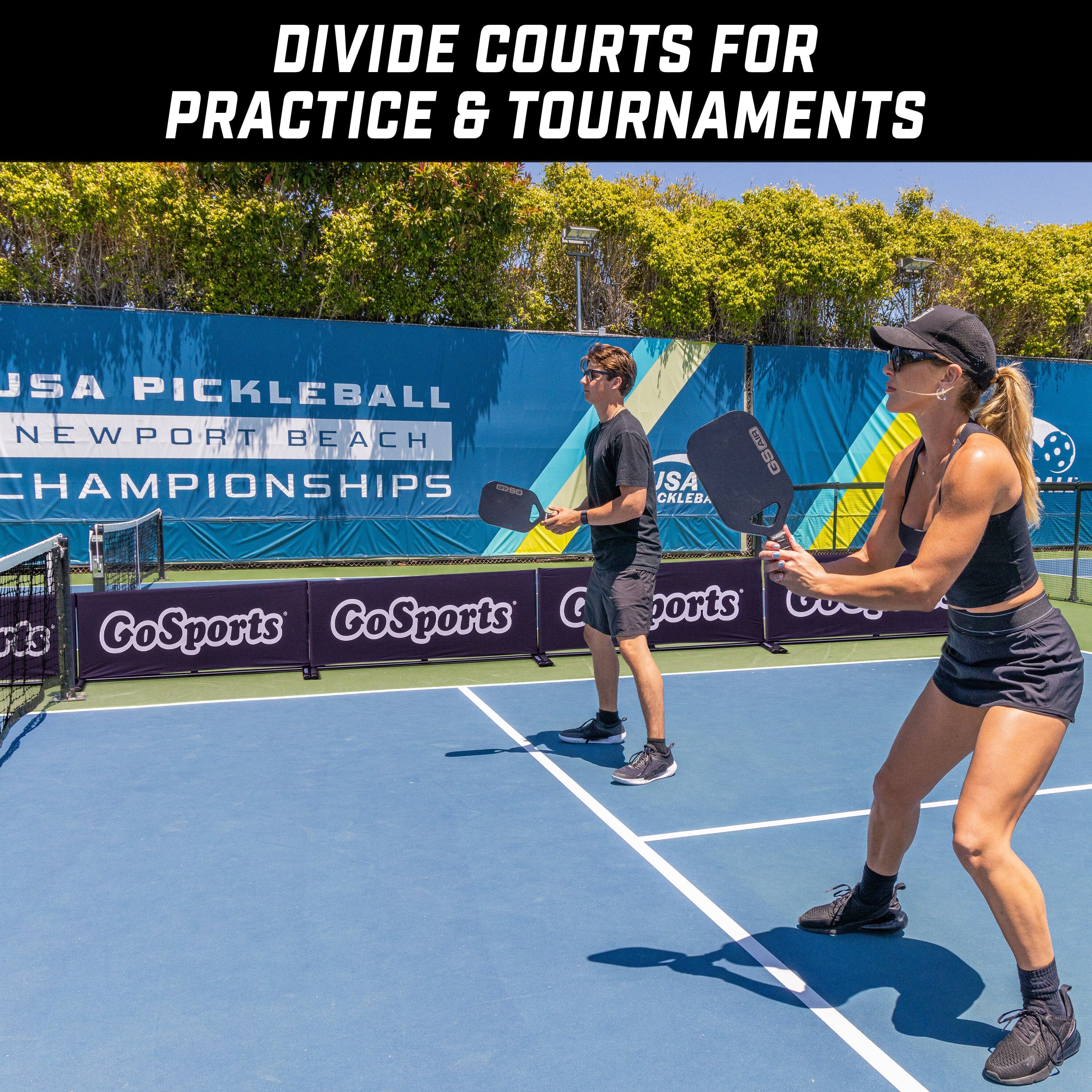 man and a woman playing pickleball on a tennis court with barrier on background logo gosports