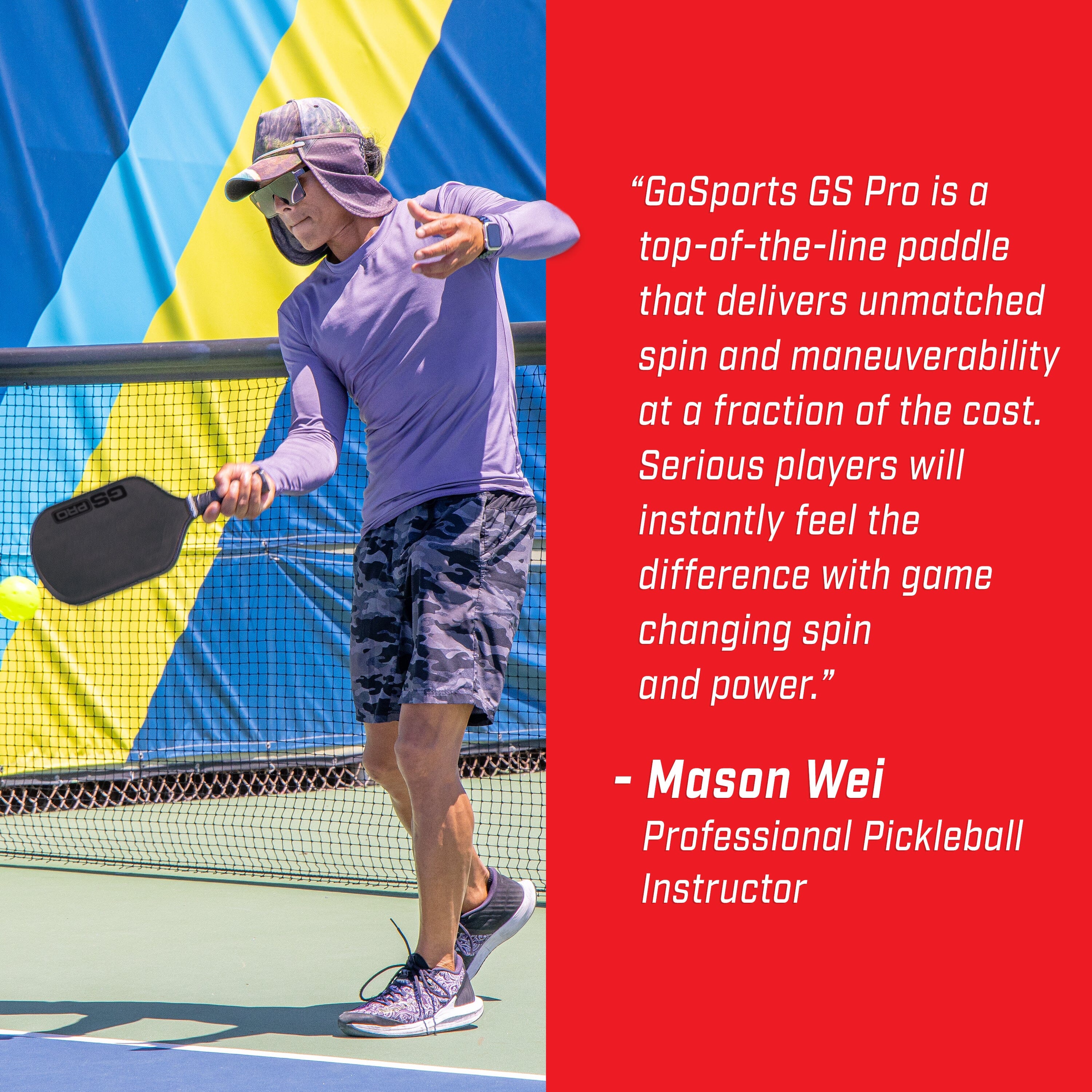 a man in a purple shirt and blue shorts playing tennis