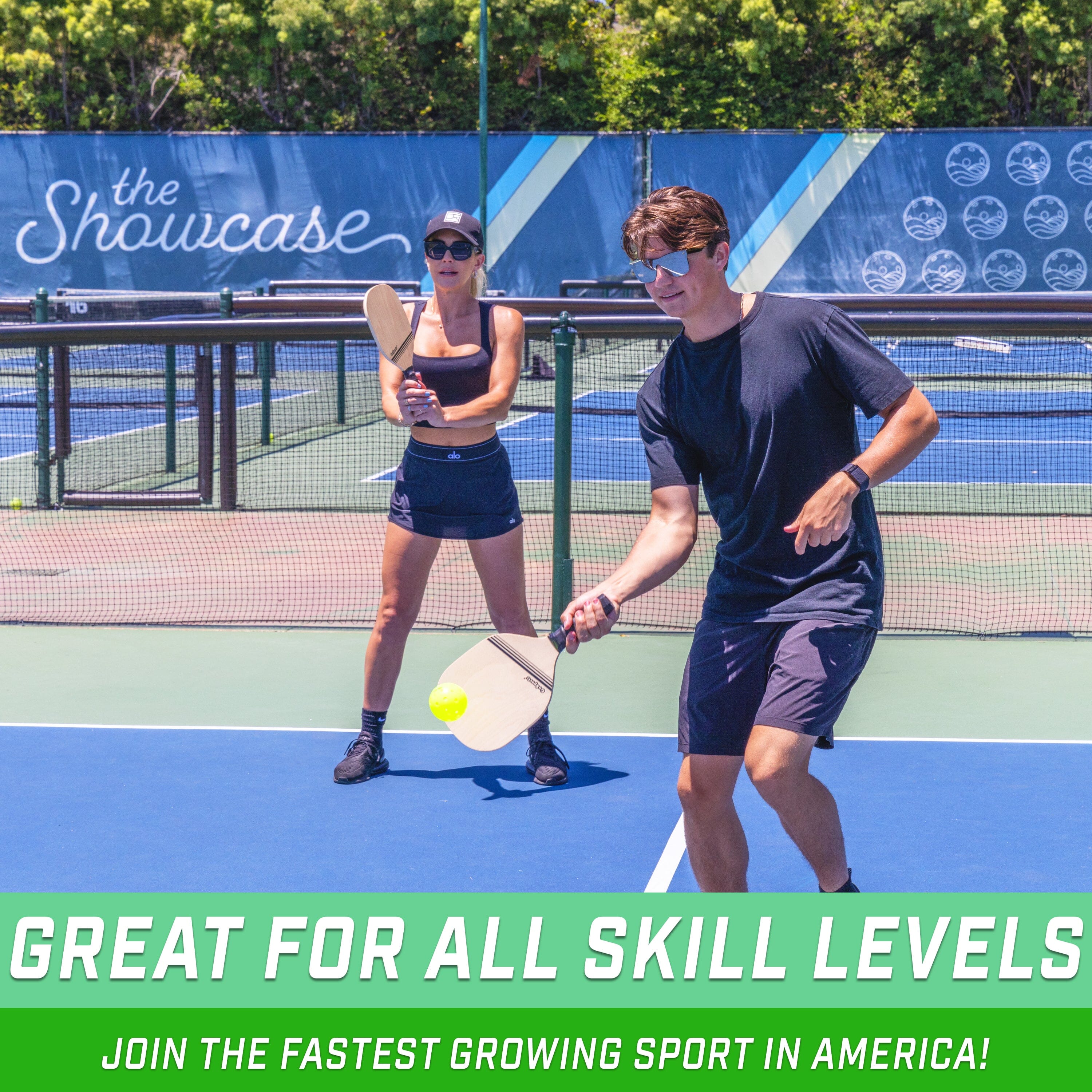 two people playing tennis on a tennis court