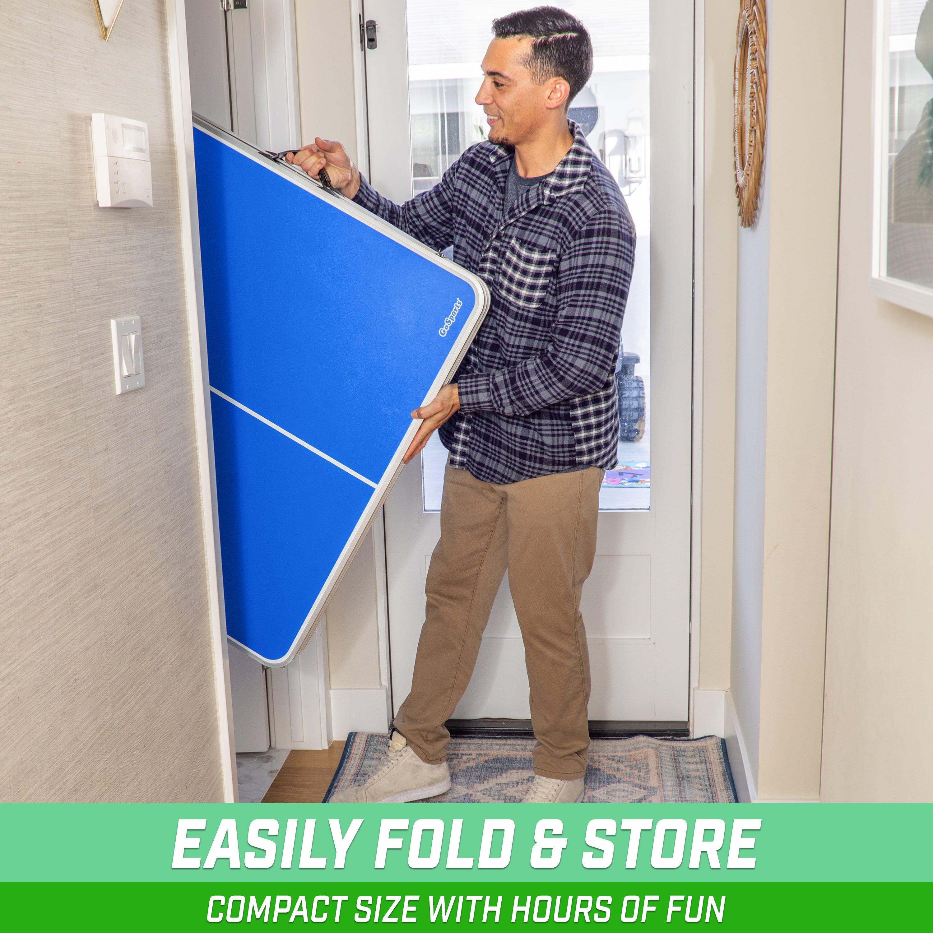 a man holding a blue sign in his hand