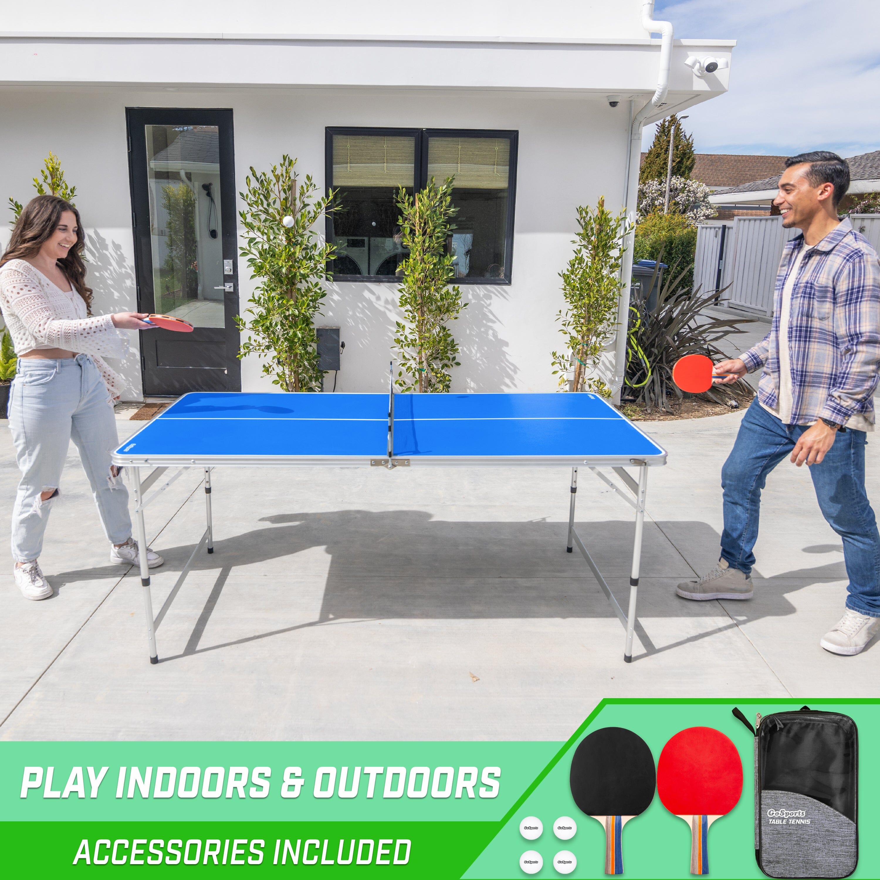 a couple playing ping pong on a patio