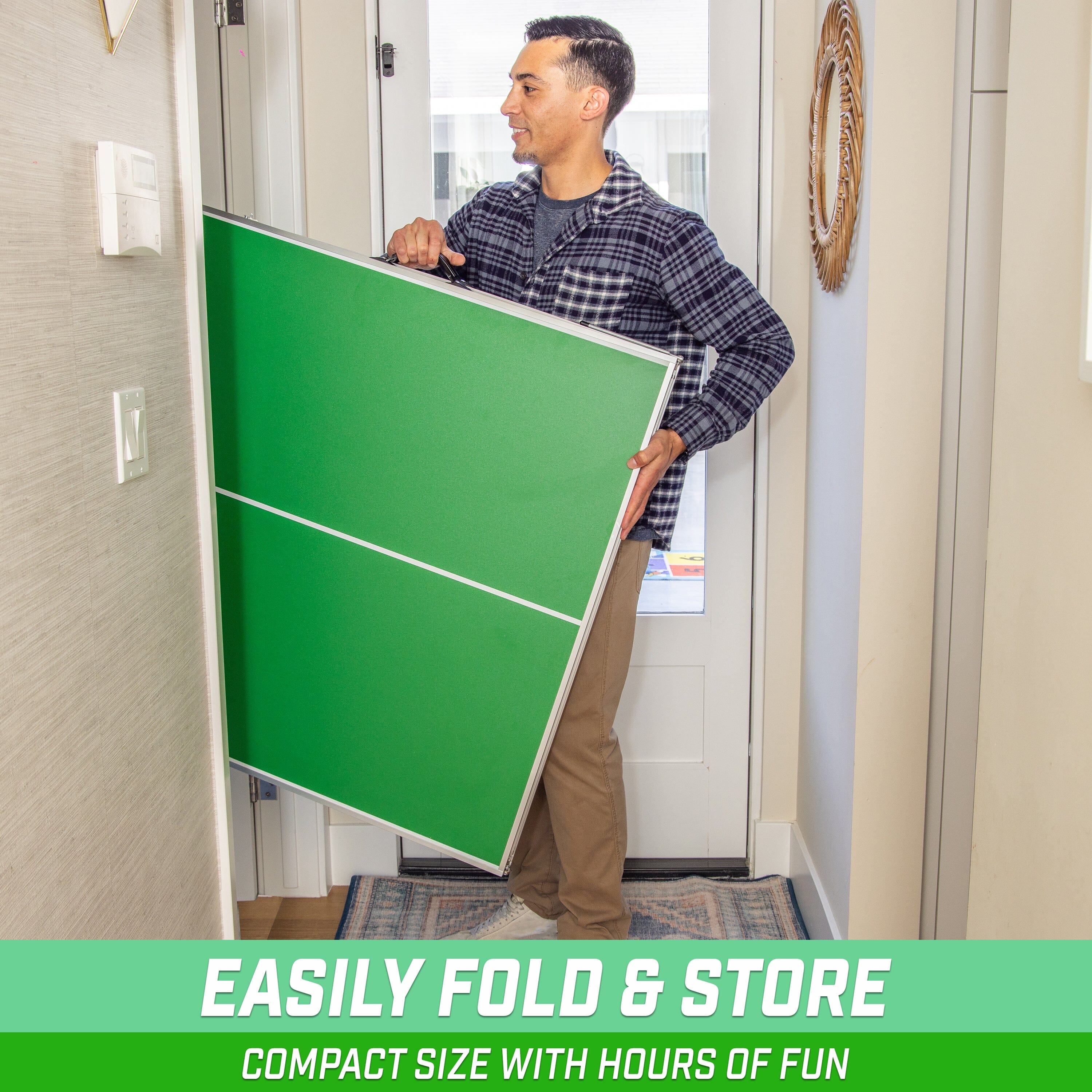 a man holding a green board in his hand