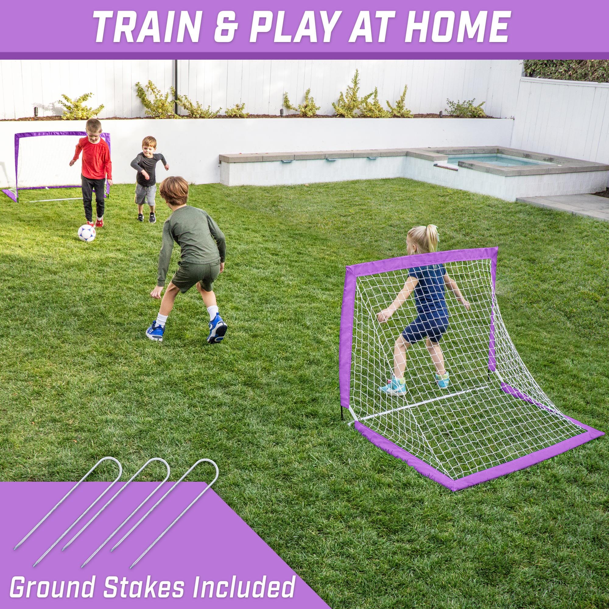 a backyard play area with a soccer goal and a soccer goal