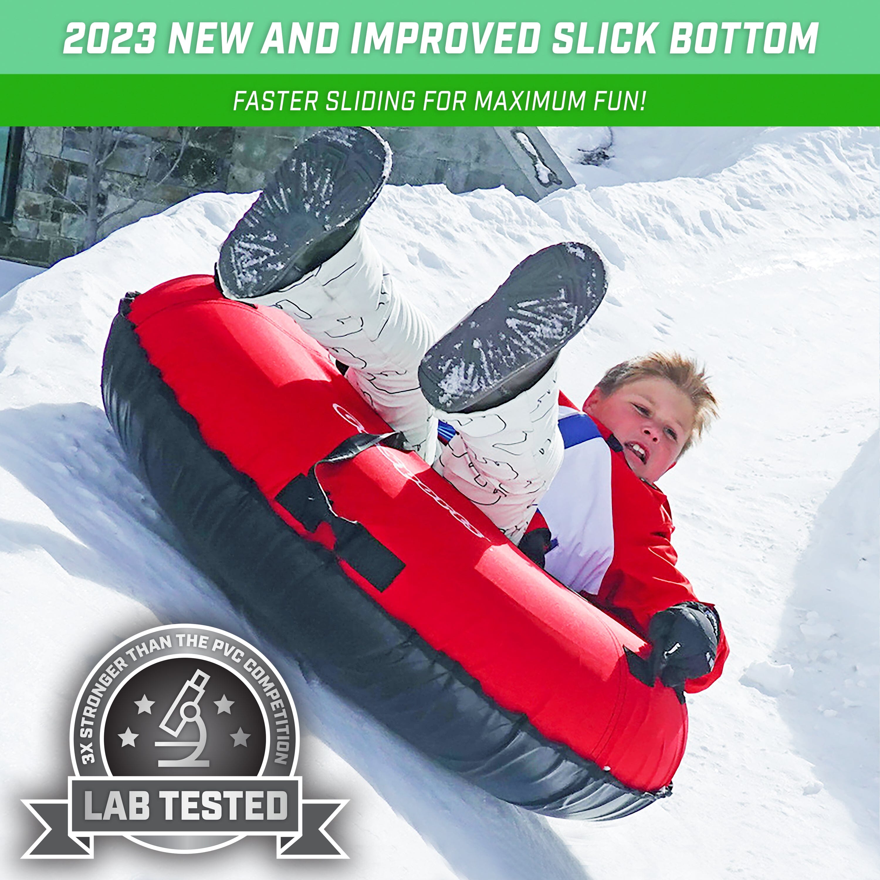 a boy laying on a snow tube