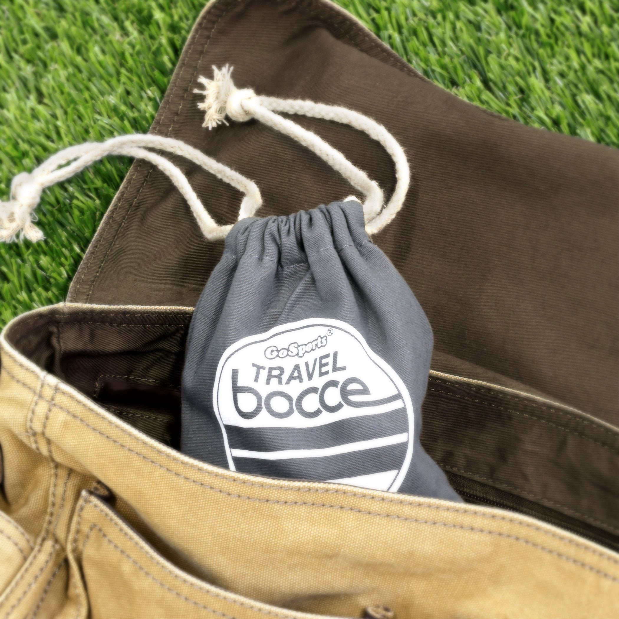 a bag with a draws on it sitting on the grass