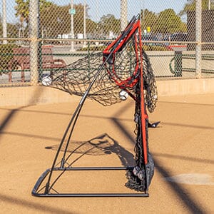 a baseball field with a catchers net