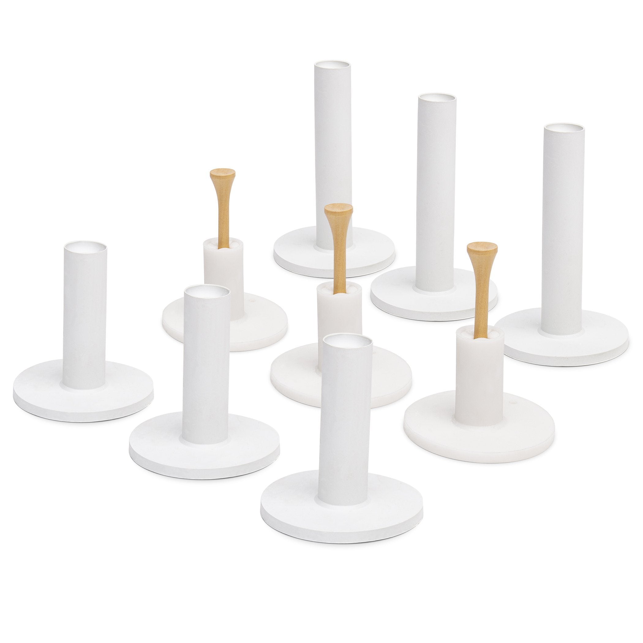 a set of white and gold candles