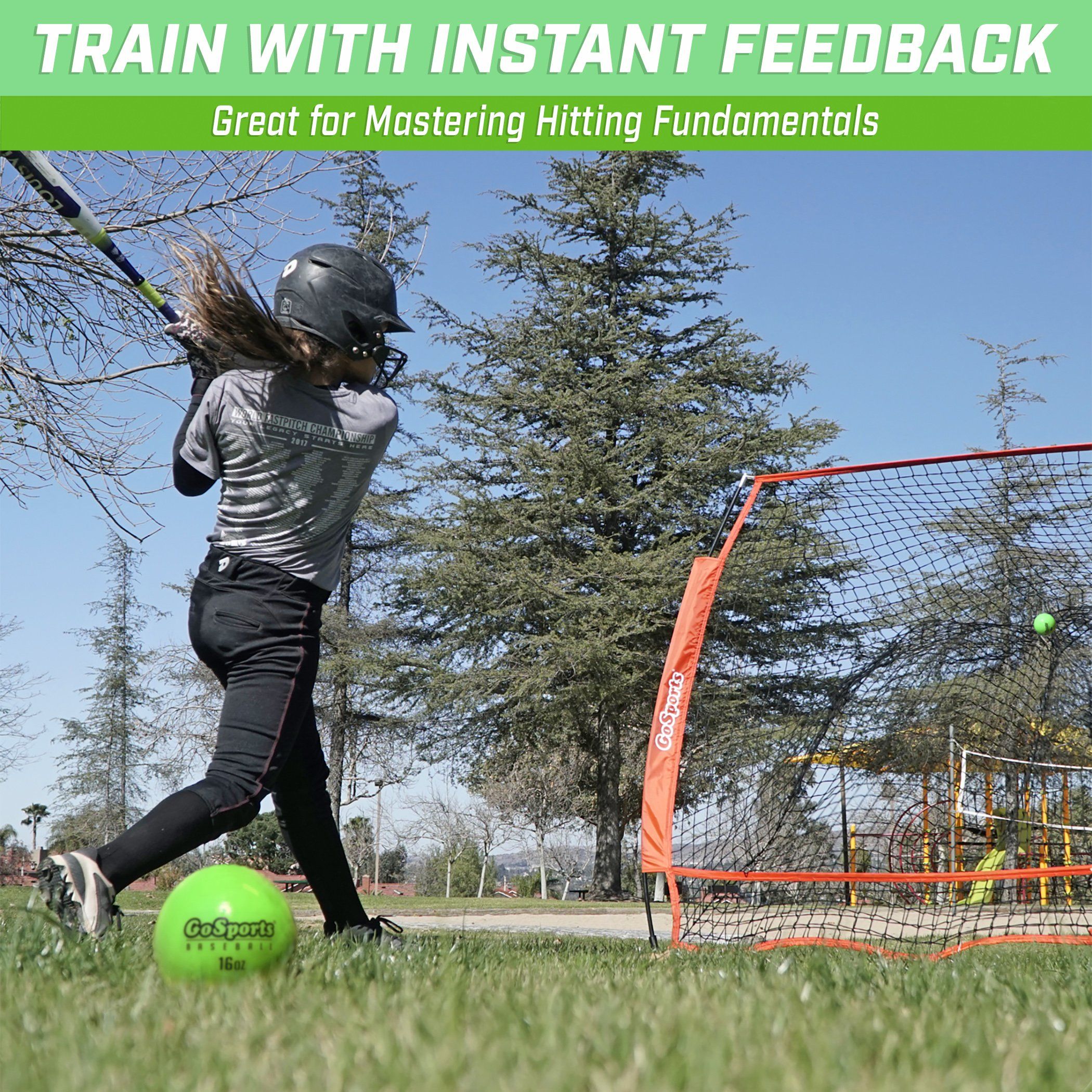 a girl hitting a ball with a tennis racket