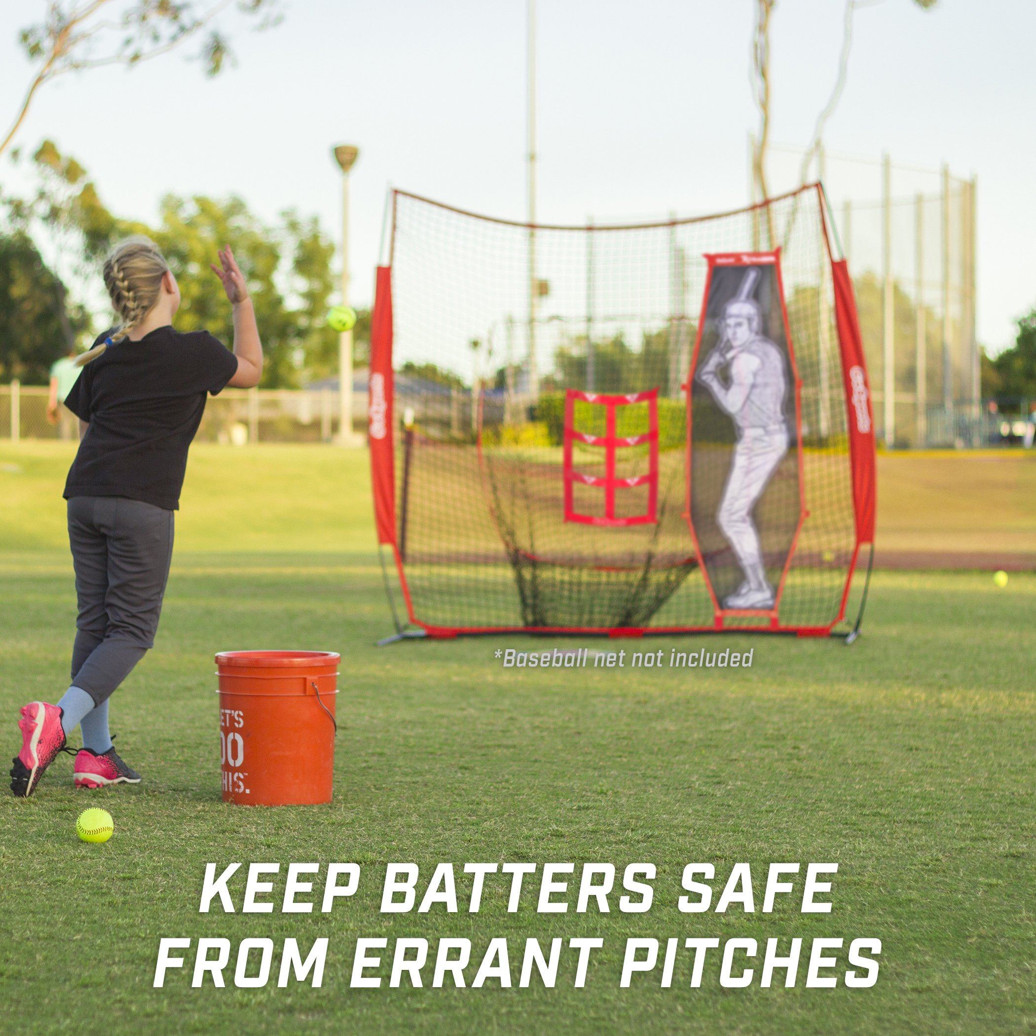 a young girl is hitting a ball with a baseball bat