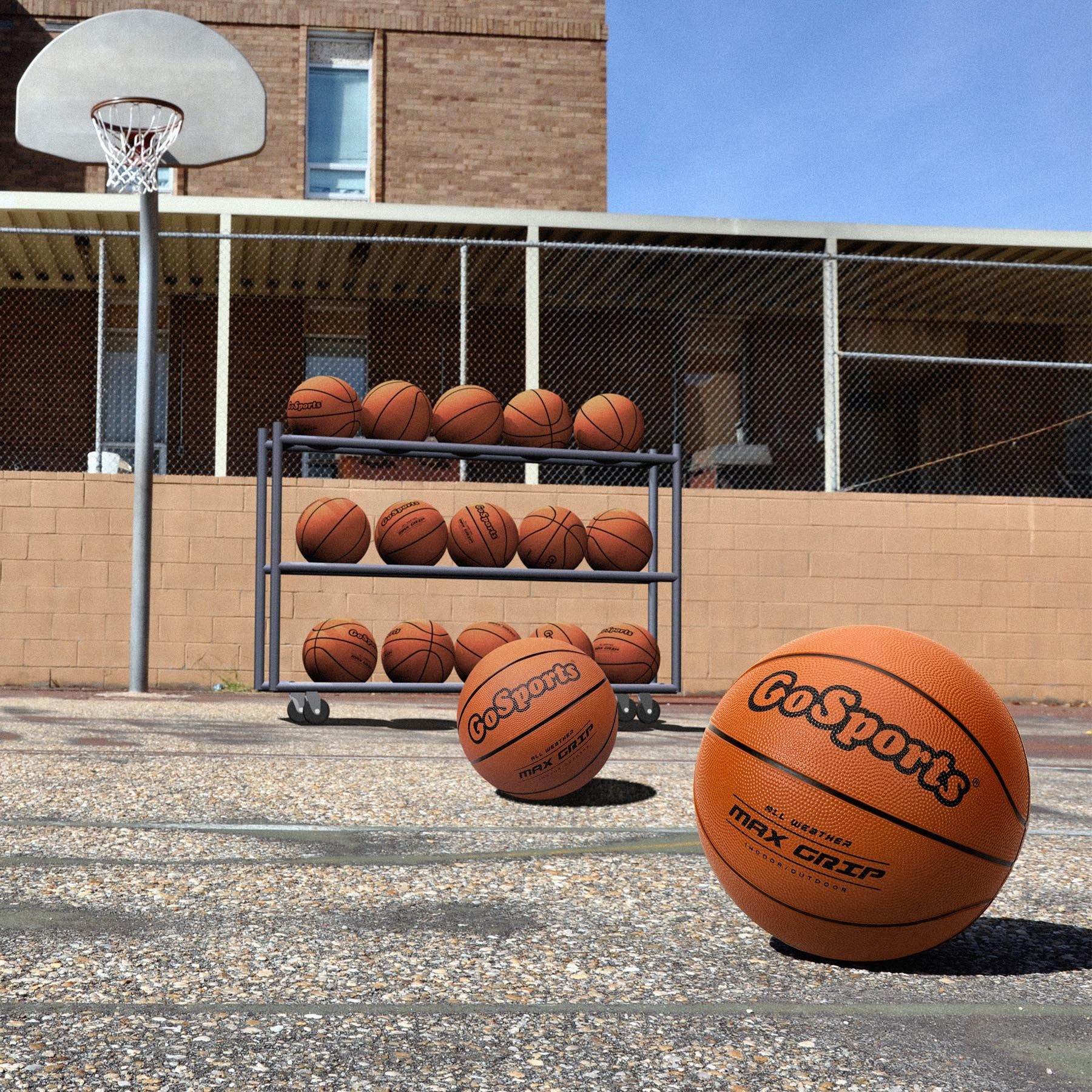 a basketball court with several balls on it