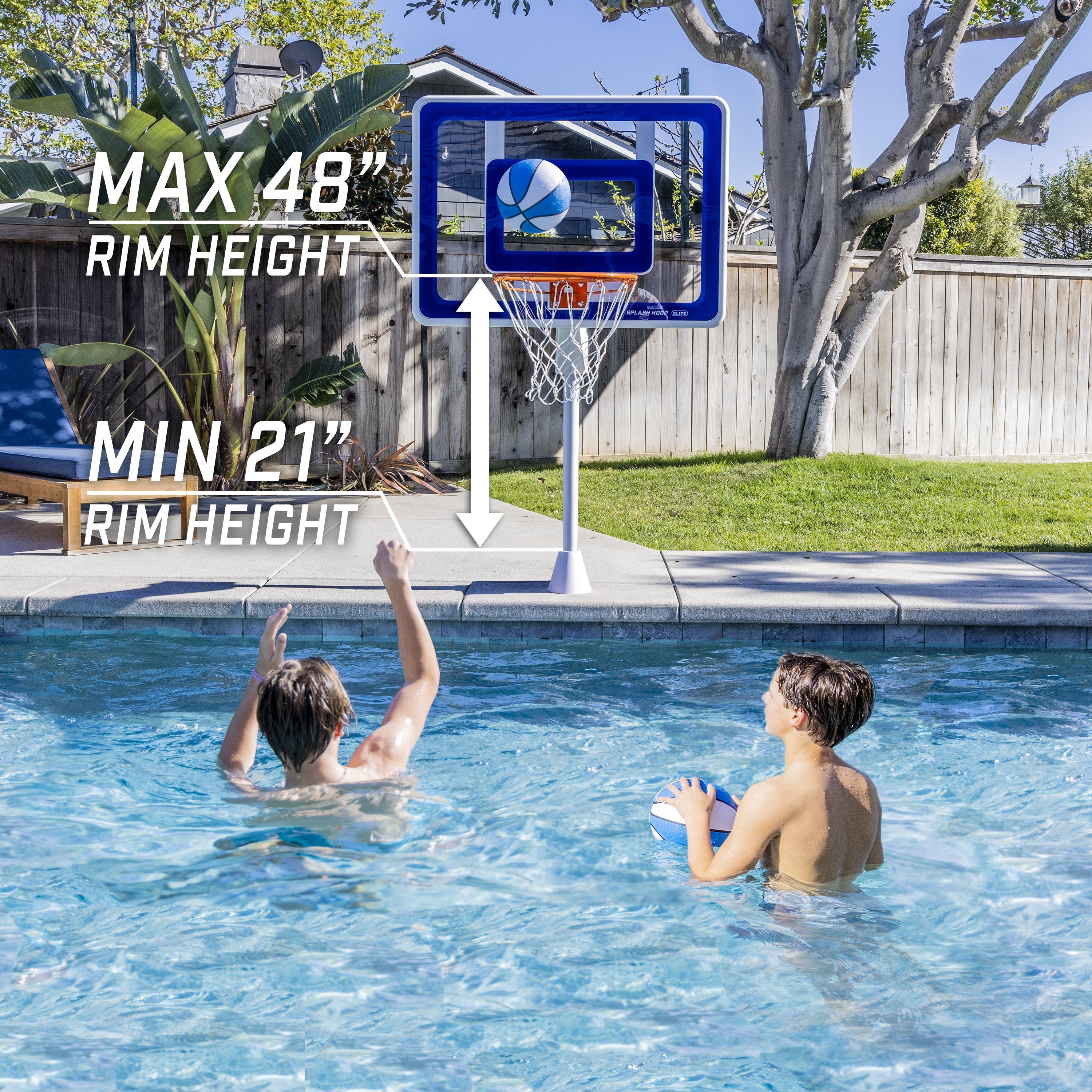 a couple of people playing basketball in a pool