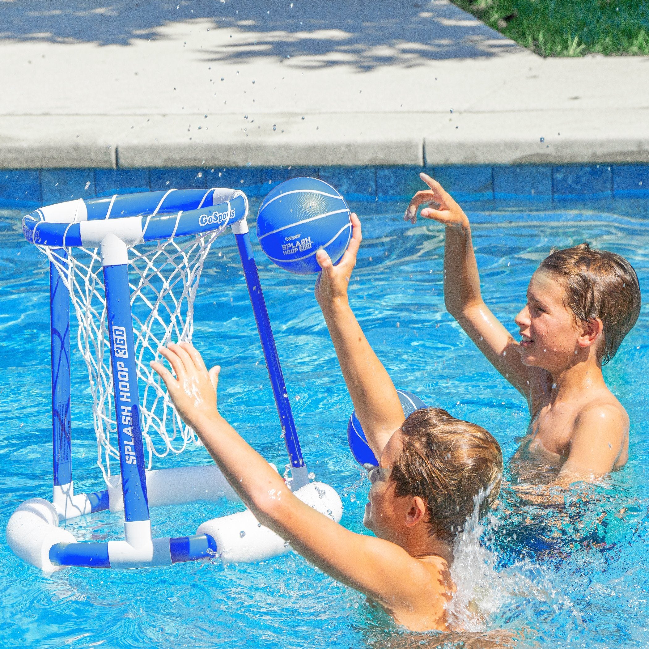two boys playing with a floating basketball net