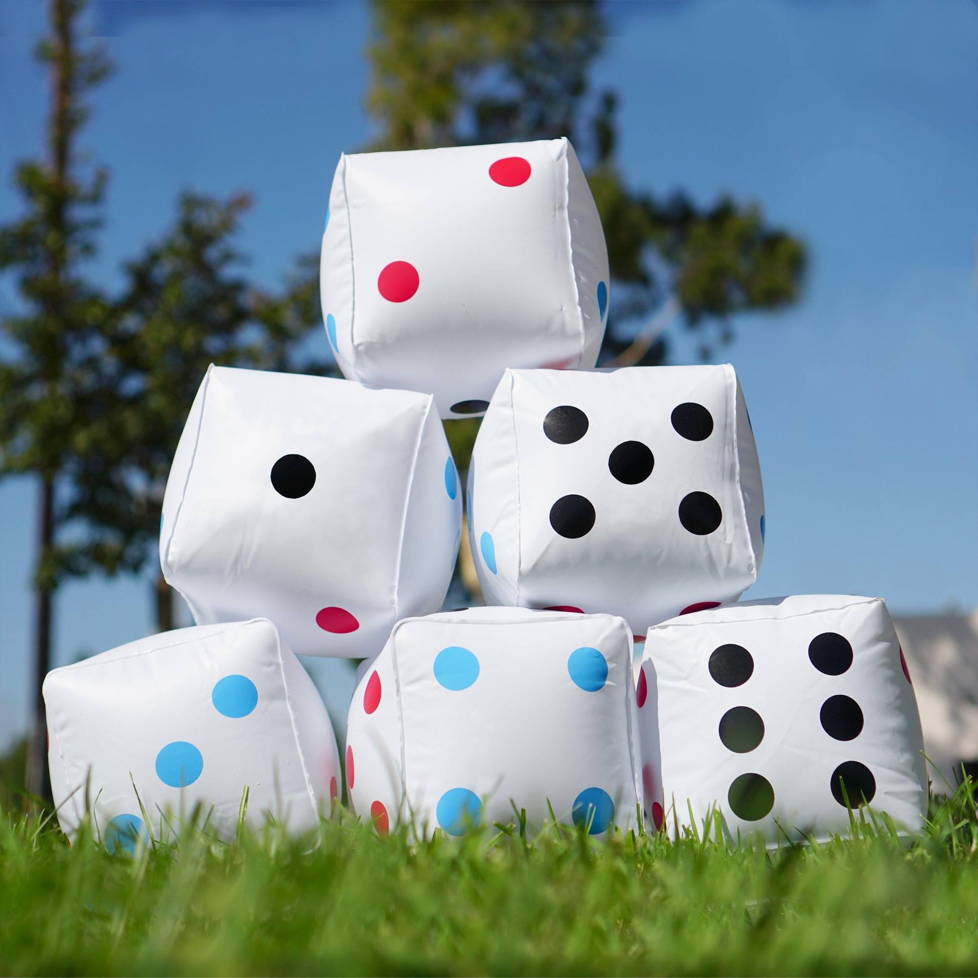 a bunch of pillows sitting in the grass