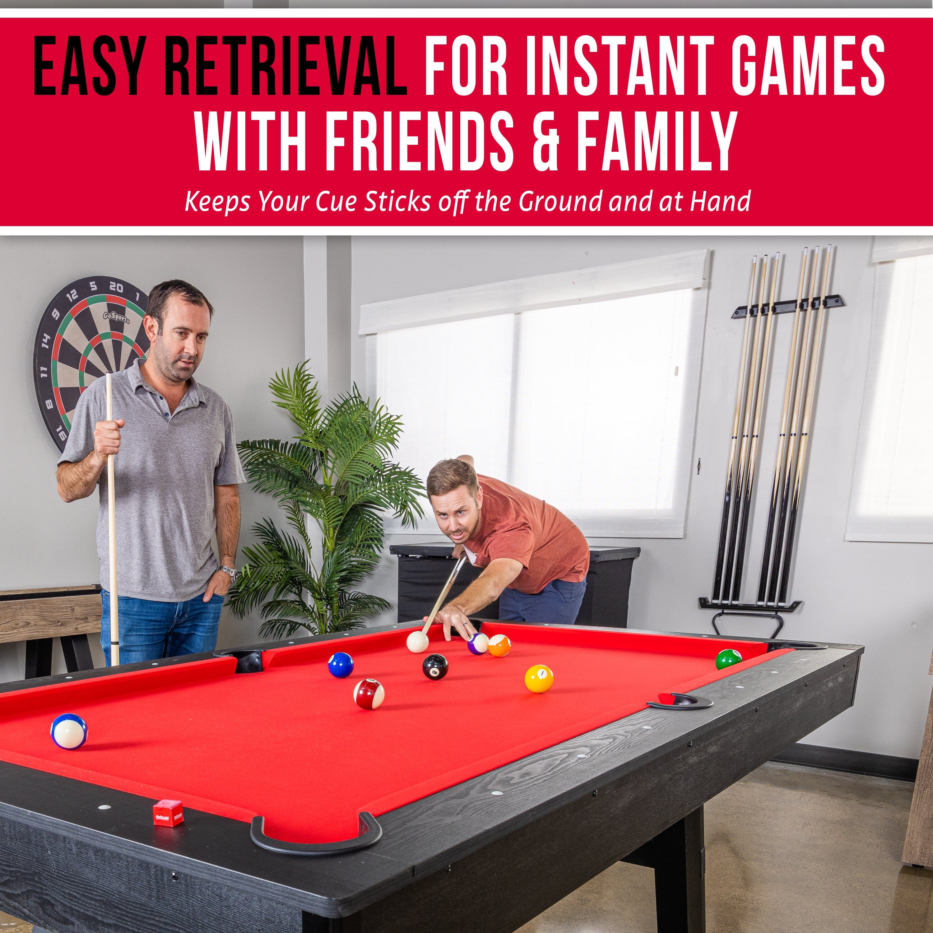 a man and woman playing pool with a pool ball