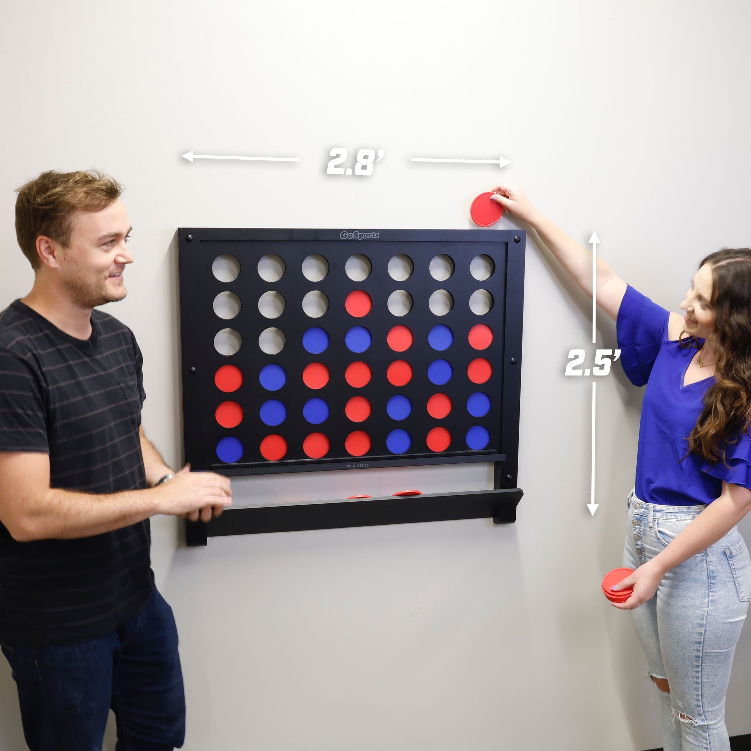 a man and woman playing a game of connect the dots