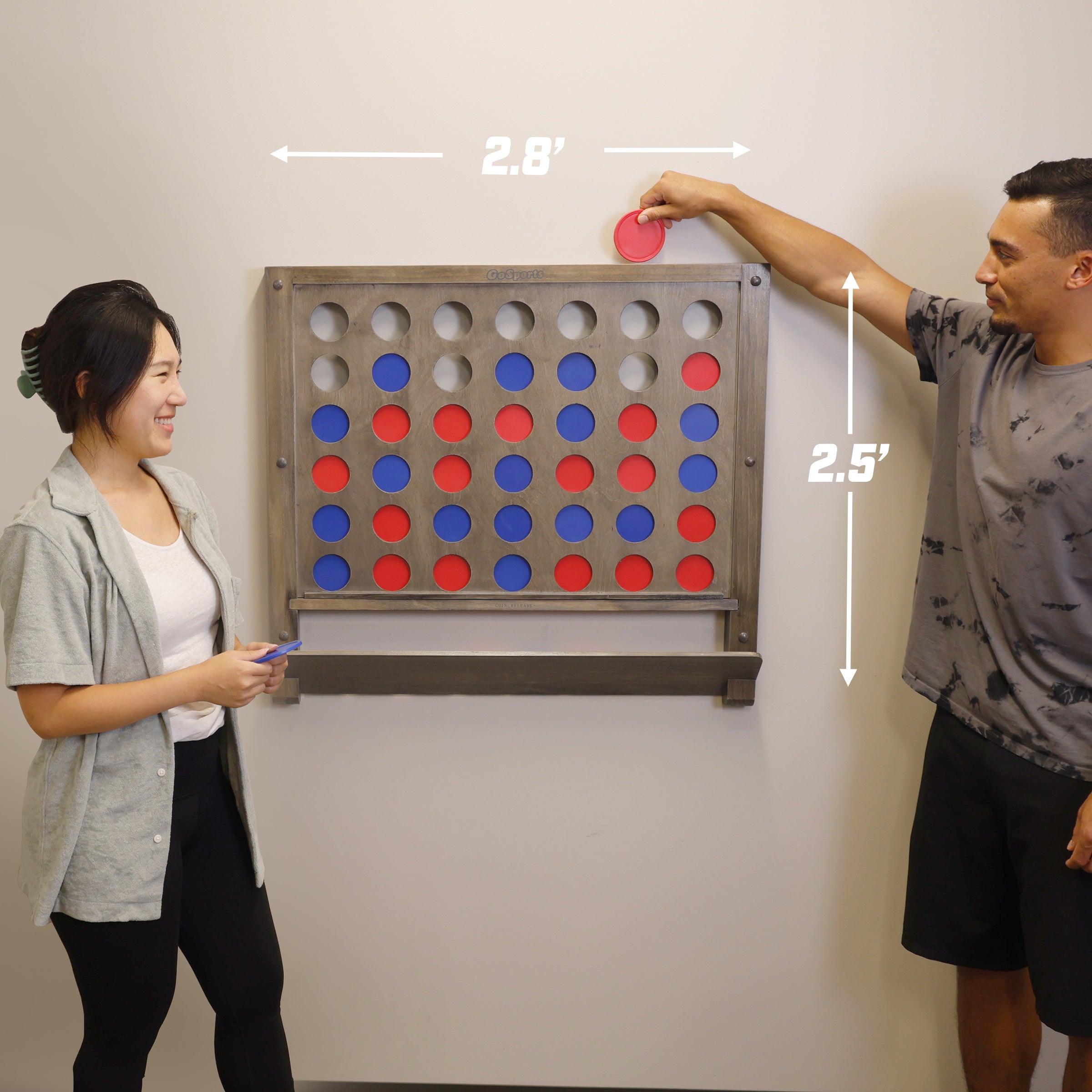 a man and woman playing a game of connect the dots