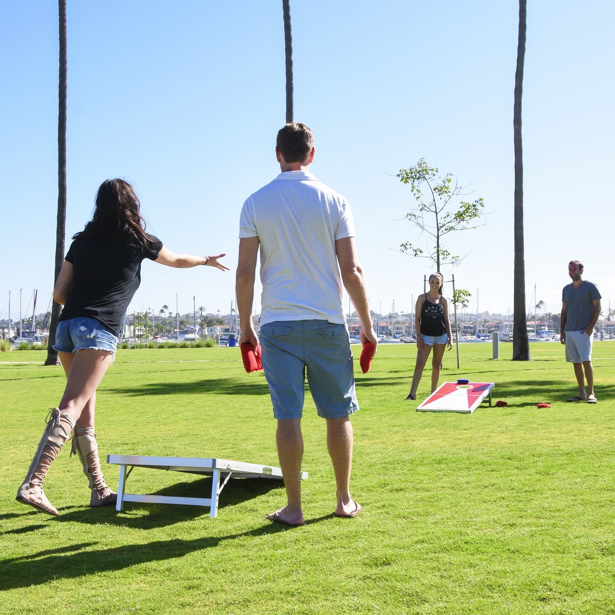 a man and woman playing frc in a park