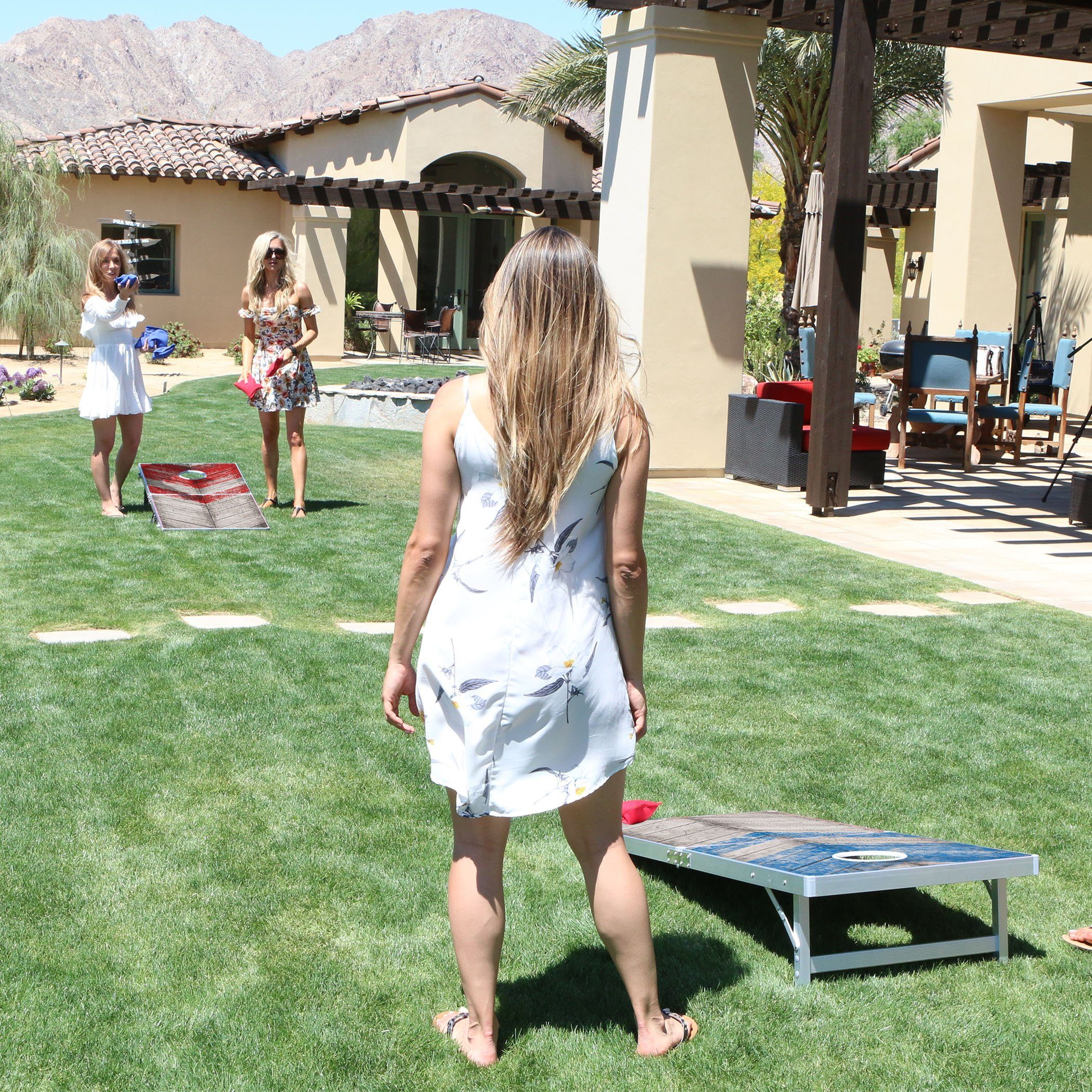 a woman in a white dress playing a game of fr fr fr