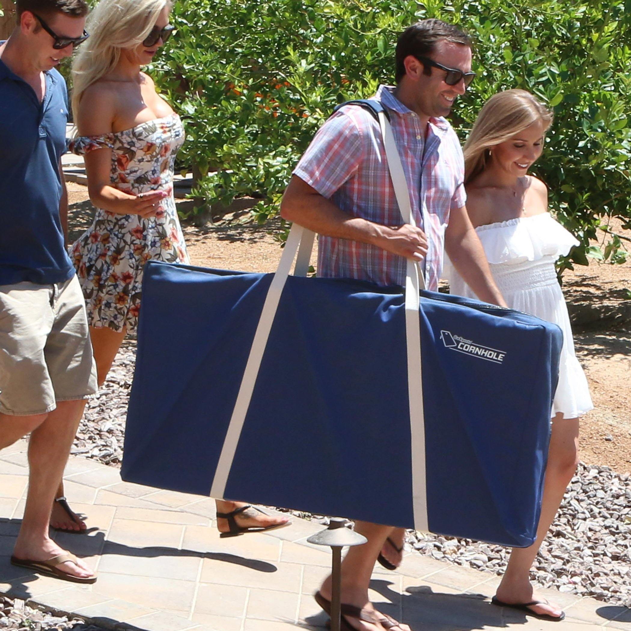 a man carrying a blue bag