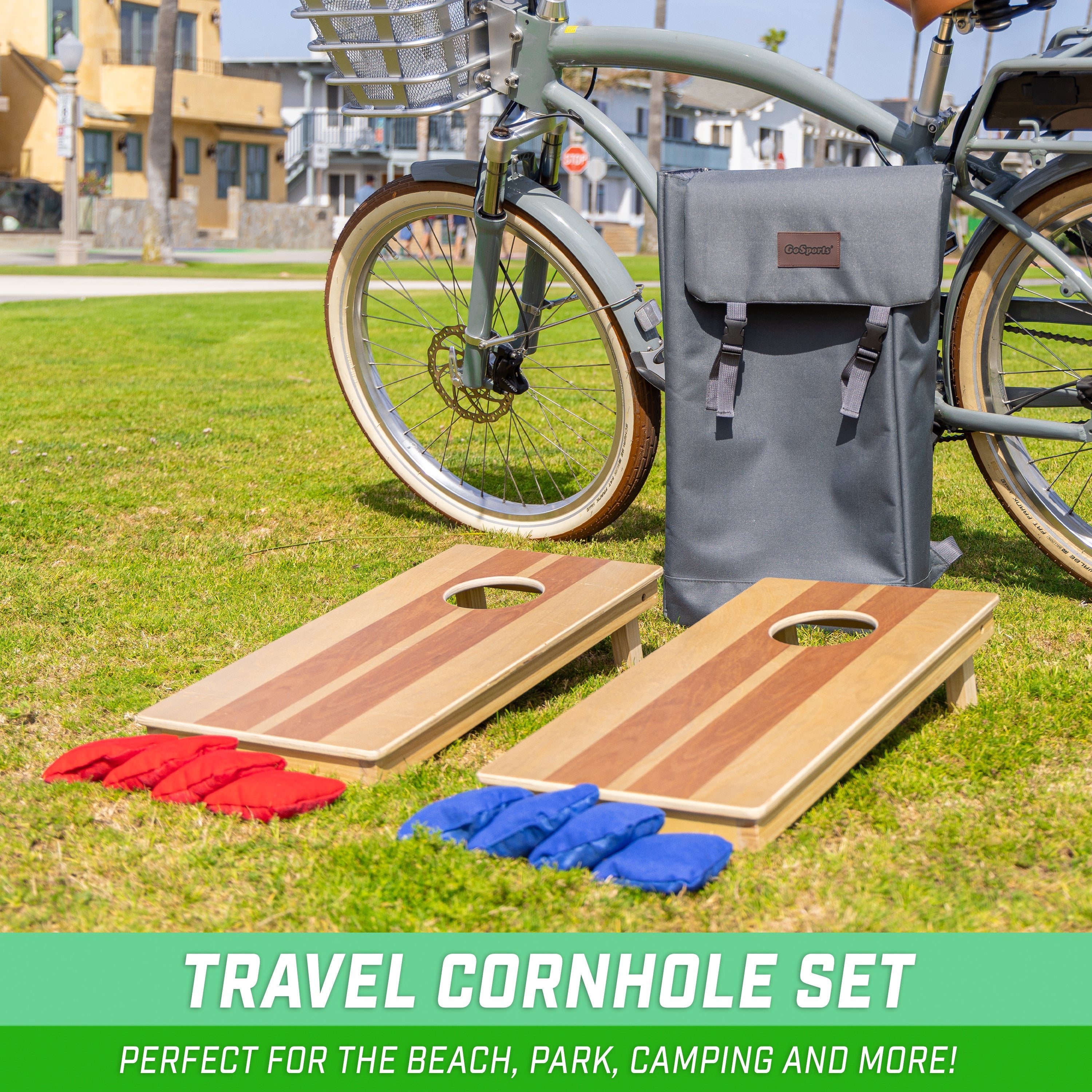a bicycle parked next to two cornhole board and gray back pack