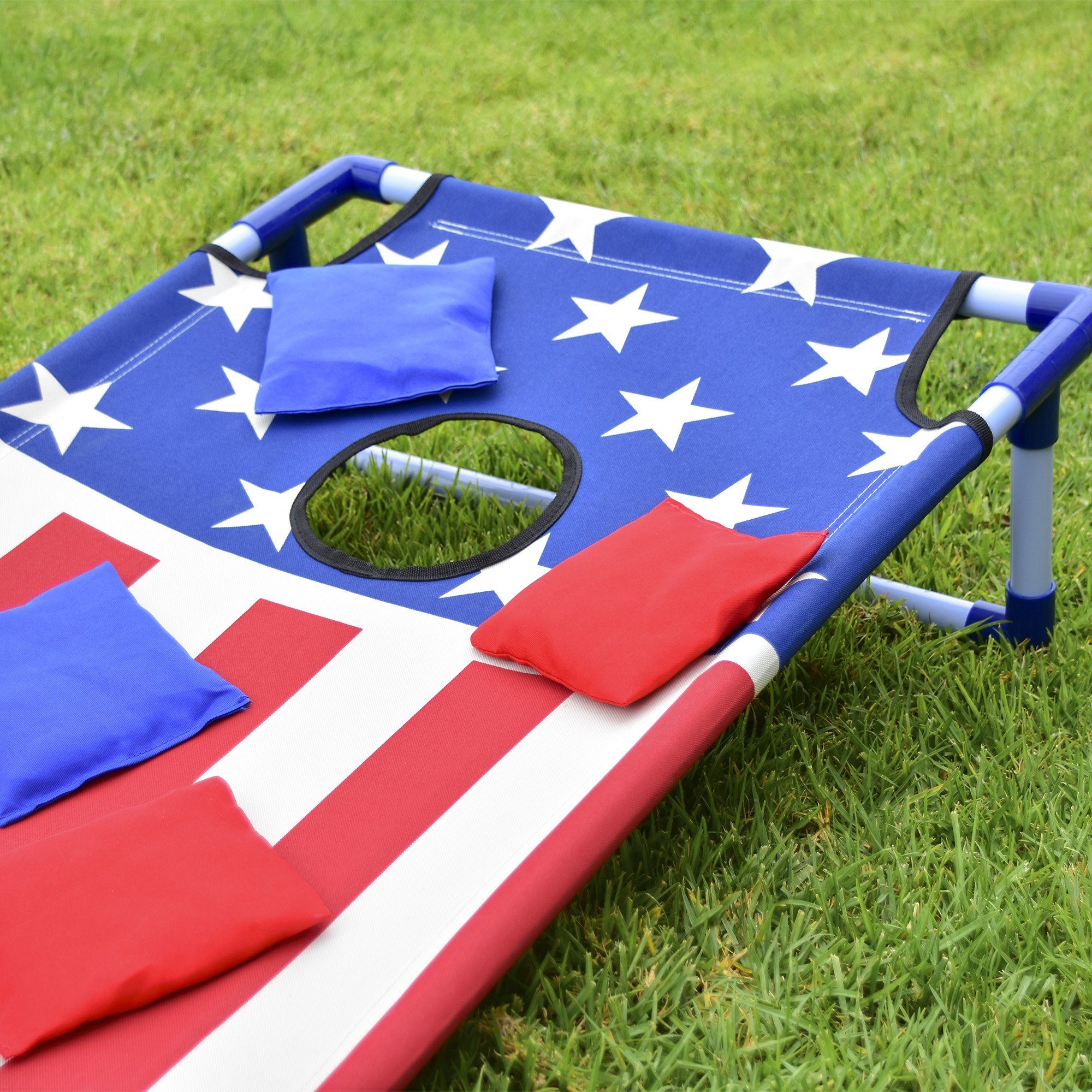 a red, white and blue flag on a lawn