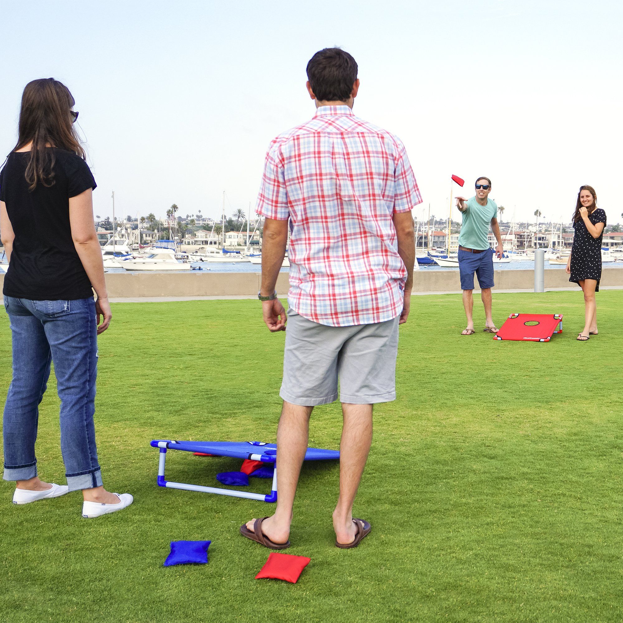 a group of people standing around a field