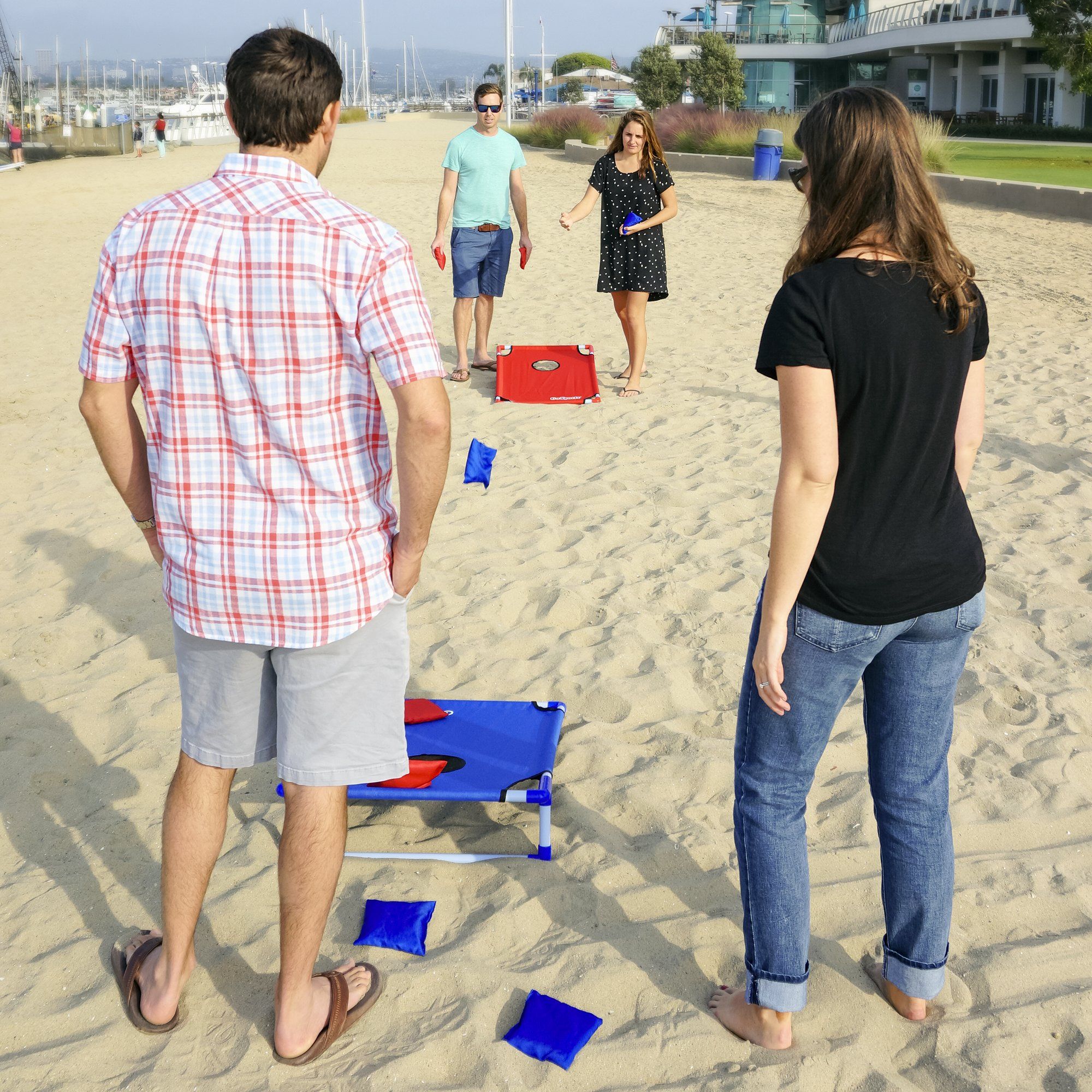 a group of people standing on a beach