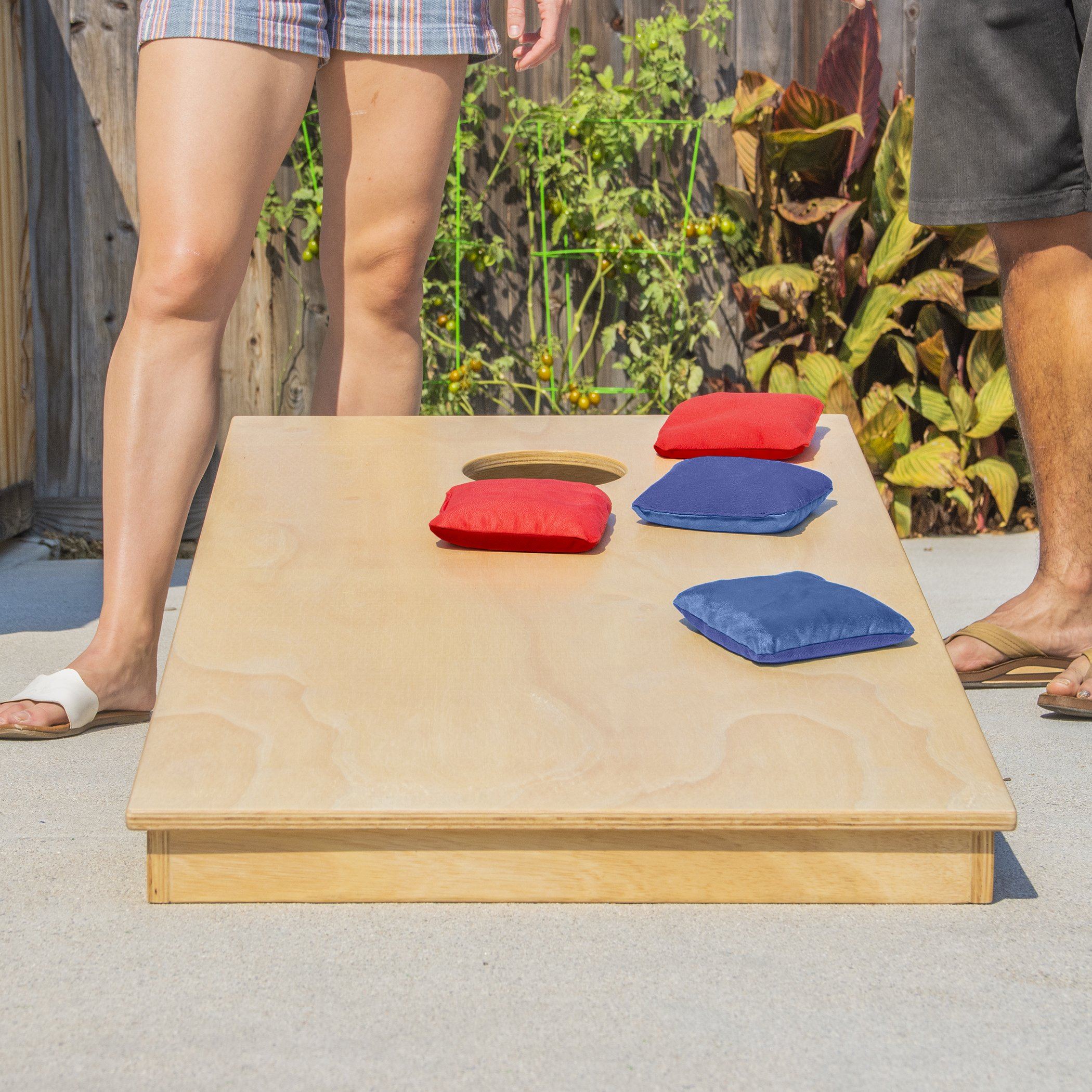 a man and a woman standing next to a table