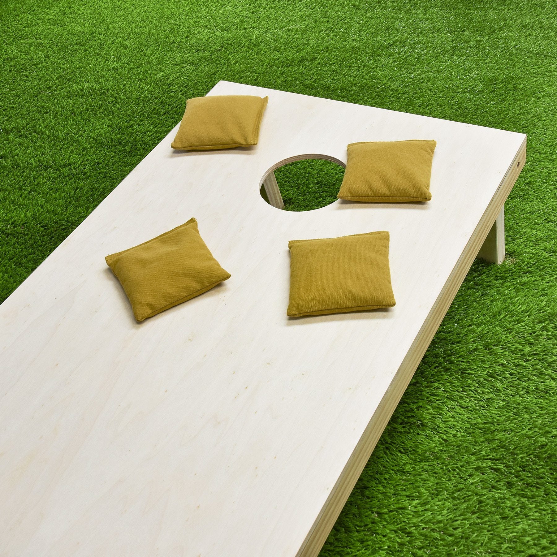 a wooden table with pillows on it