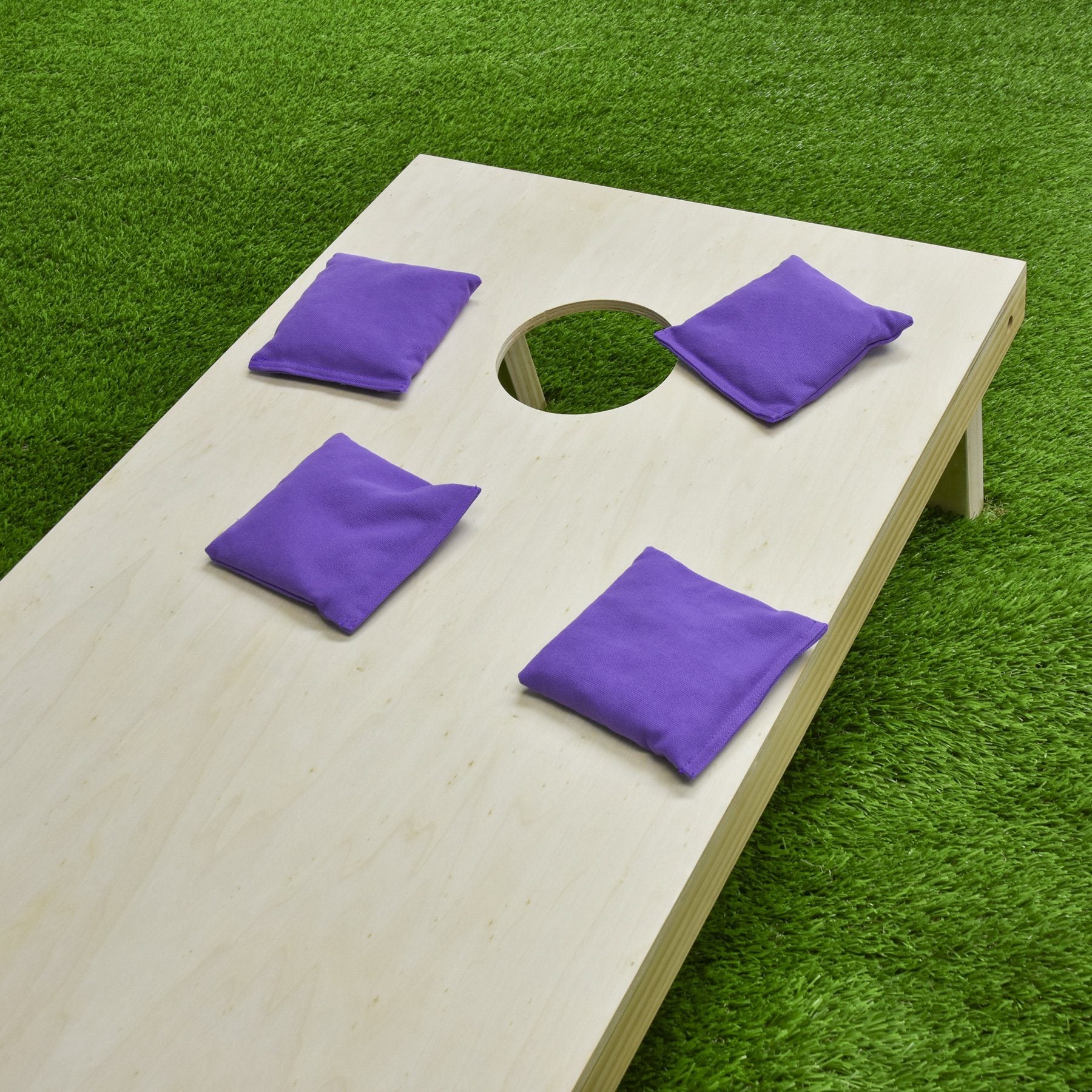 a wooden board with purple felt on it