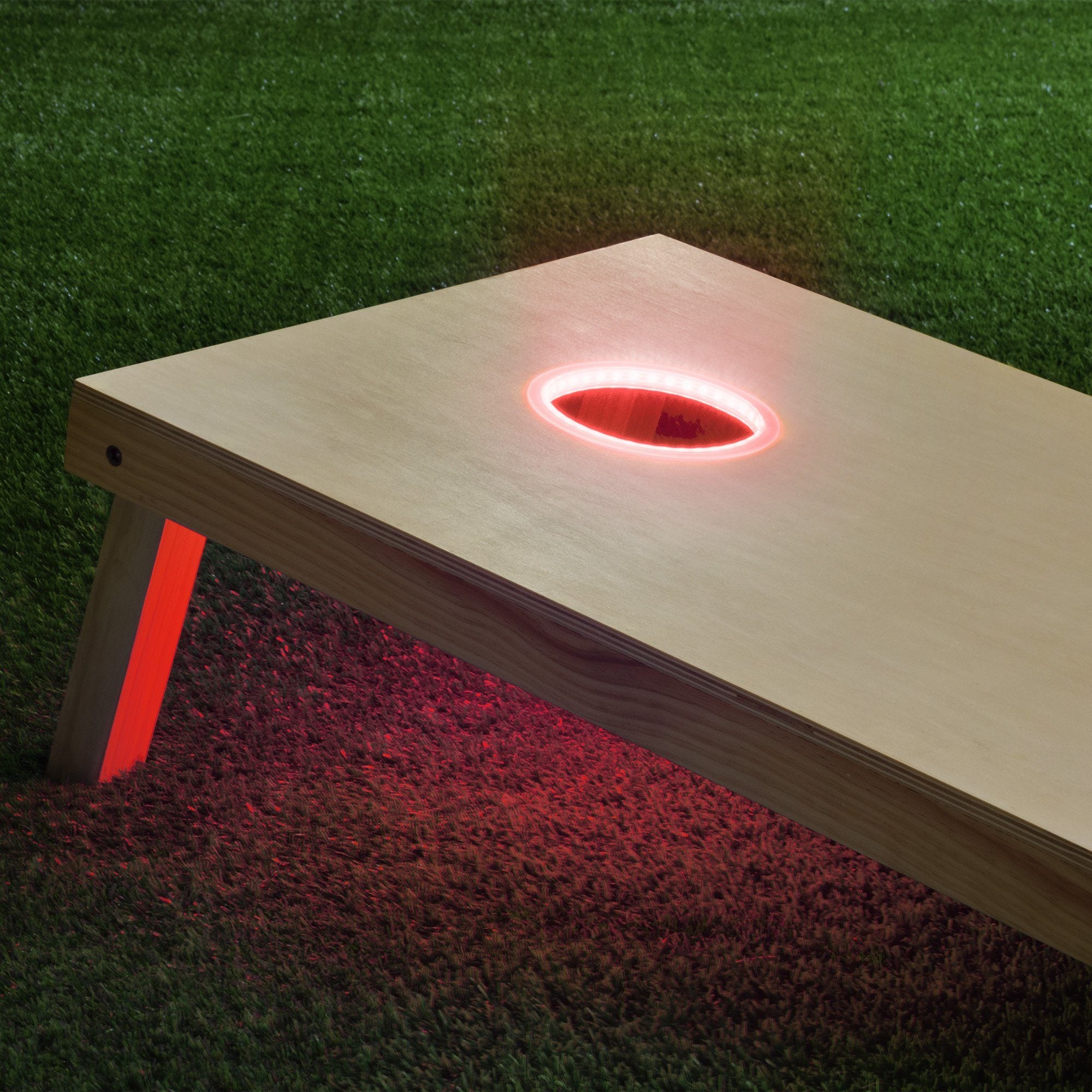 a wooden table with a red light on it