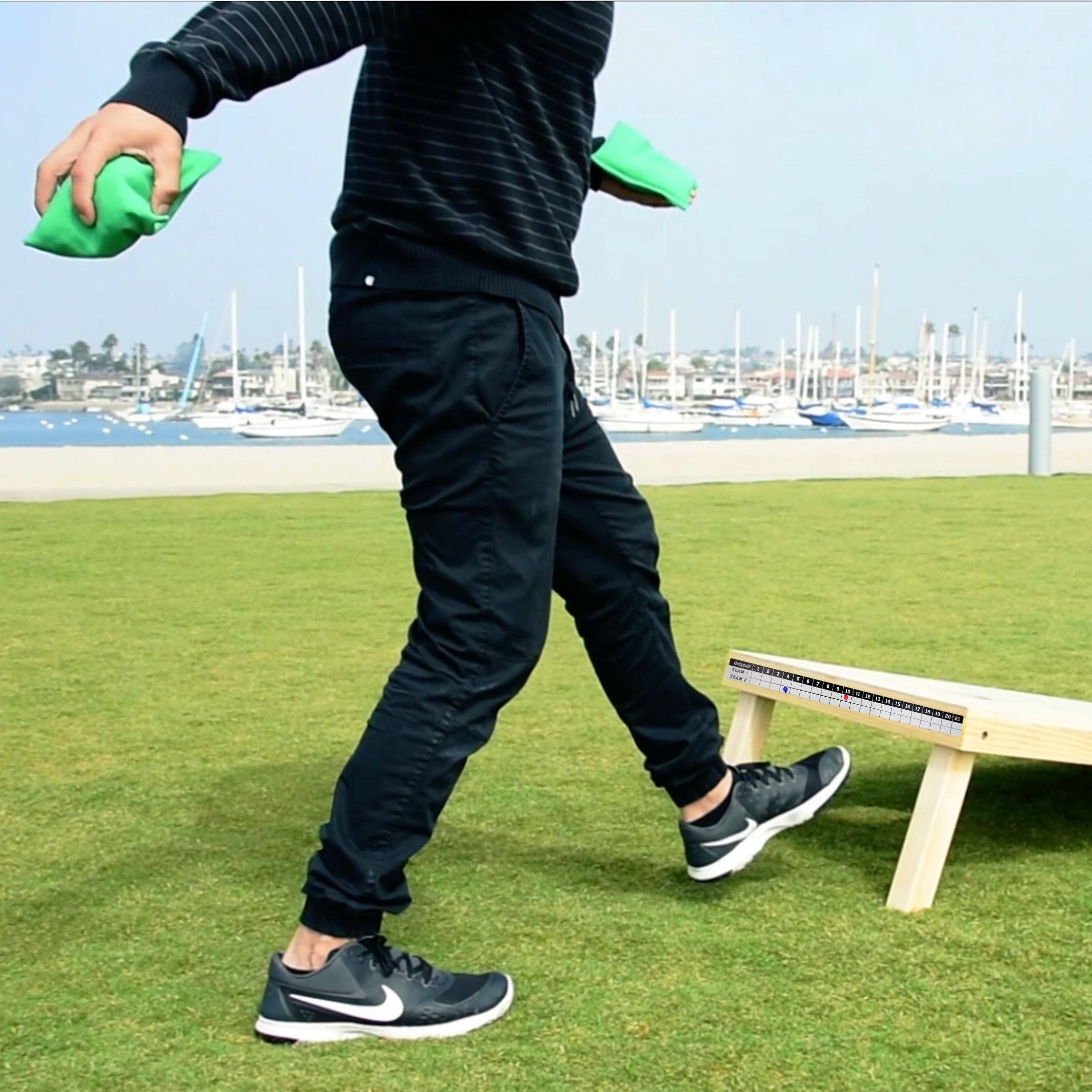 a man is playing with a frc in a park