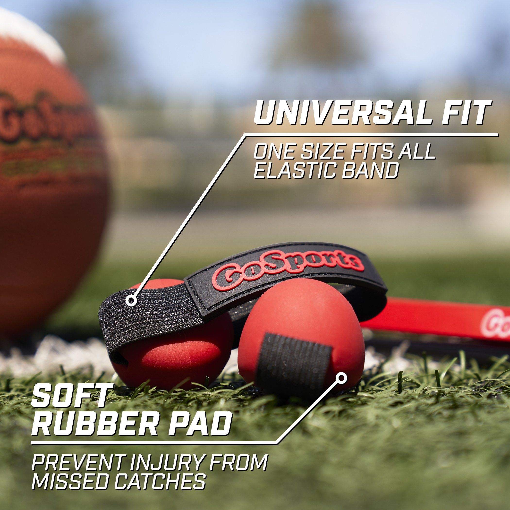 a ball and a pair of red rubber shoes on the grass