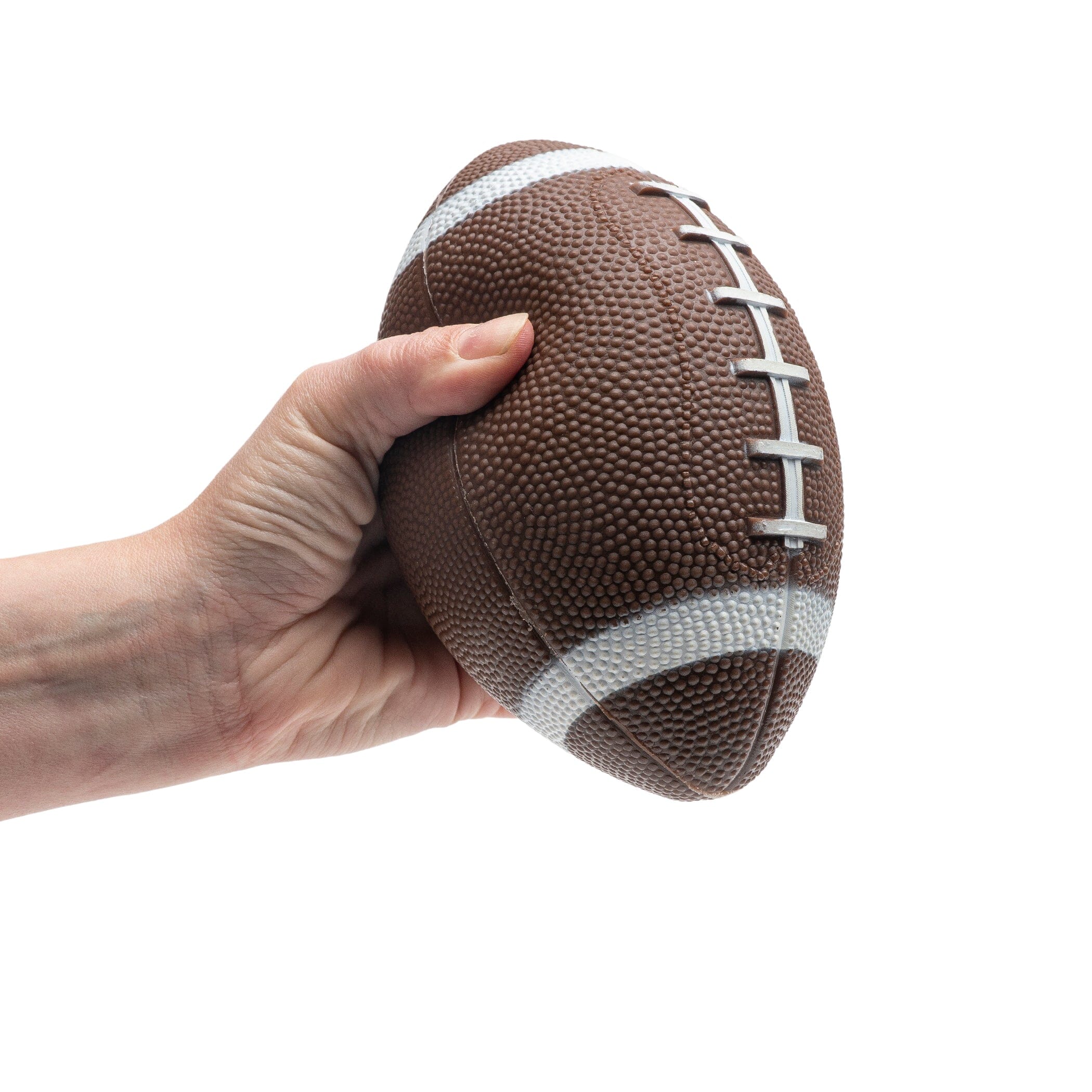 a hand holding a football on a white background