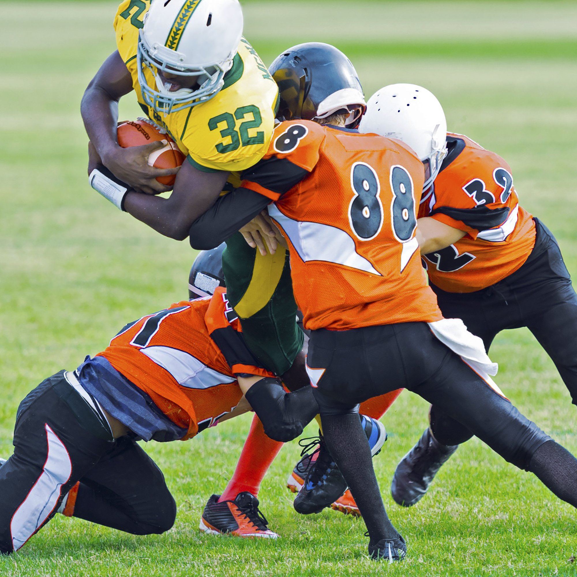 a group of young football players playing a game