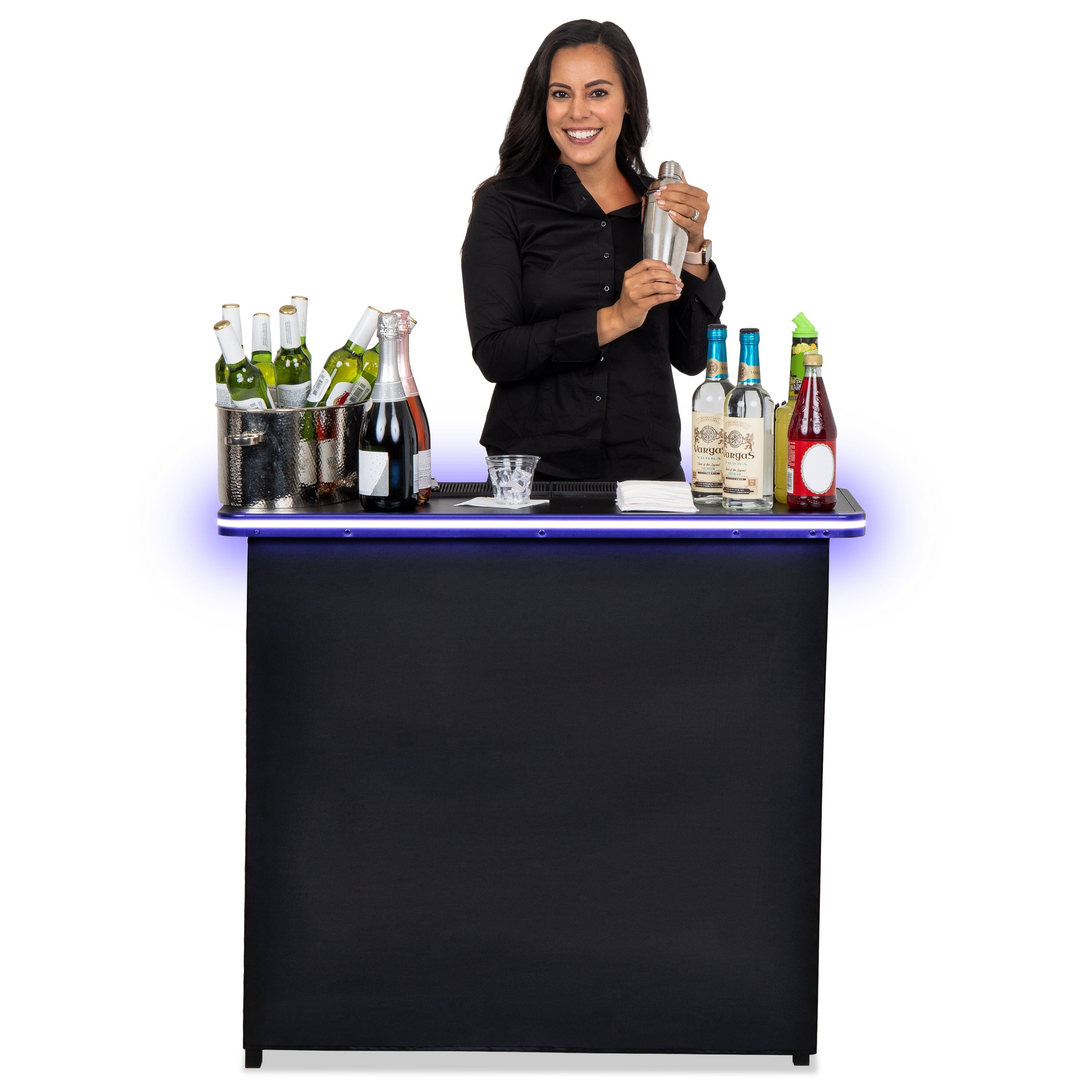 a woman standing behind a bar with bottles of alcohol