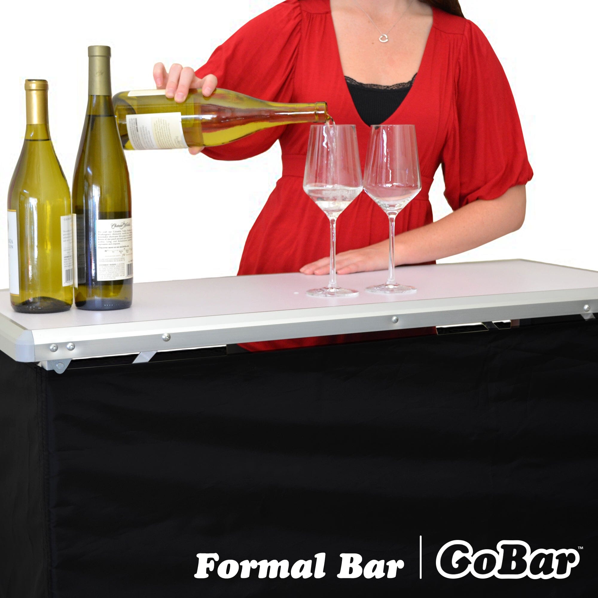 a woman pouring wine into a glass