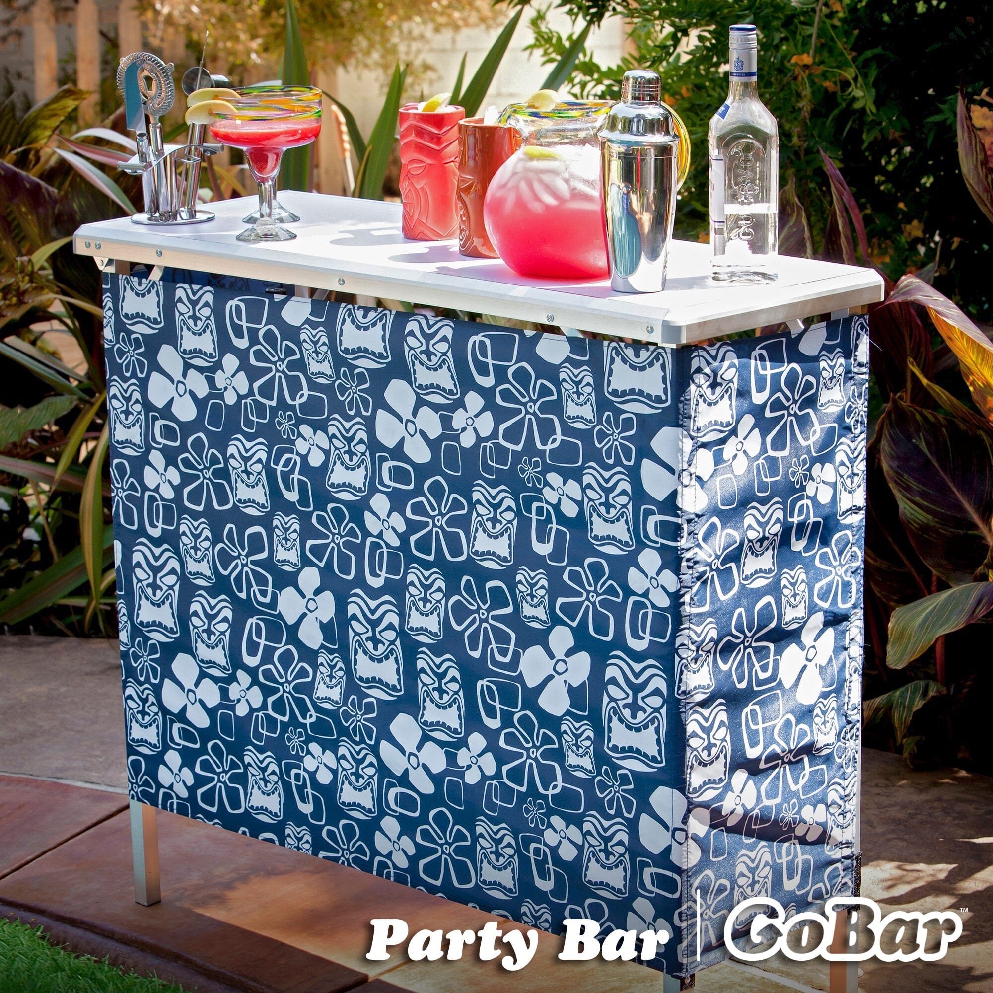 a blue and white cooler with a pattern of flowers and butterflies